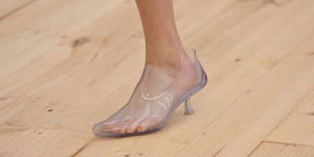 Transparent jelly sandals displayed on white background showing their clear plastic construction