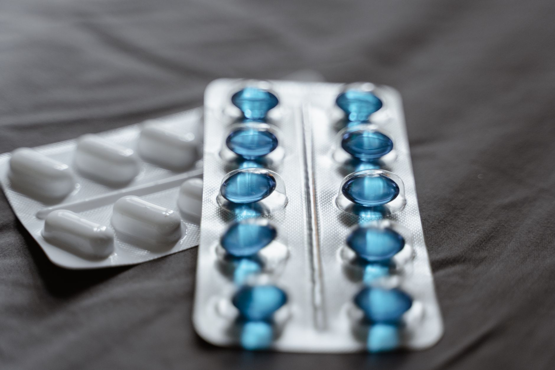 Close-up of prescription medication capsules on a white surface