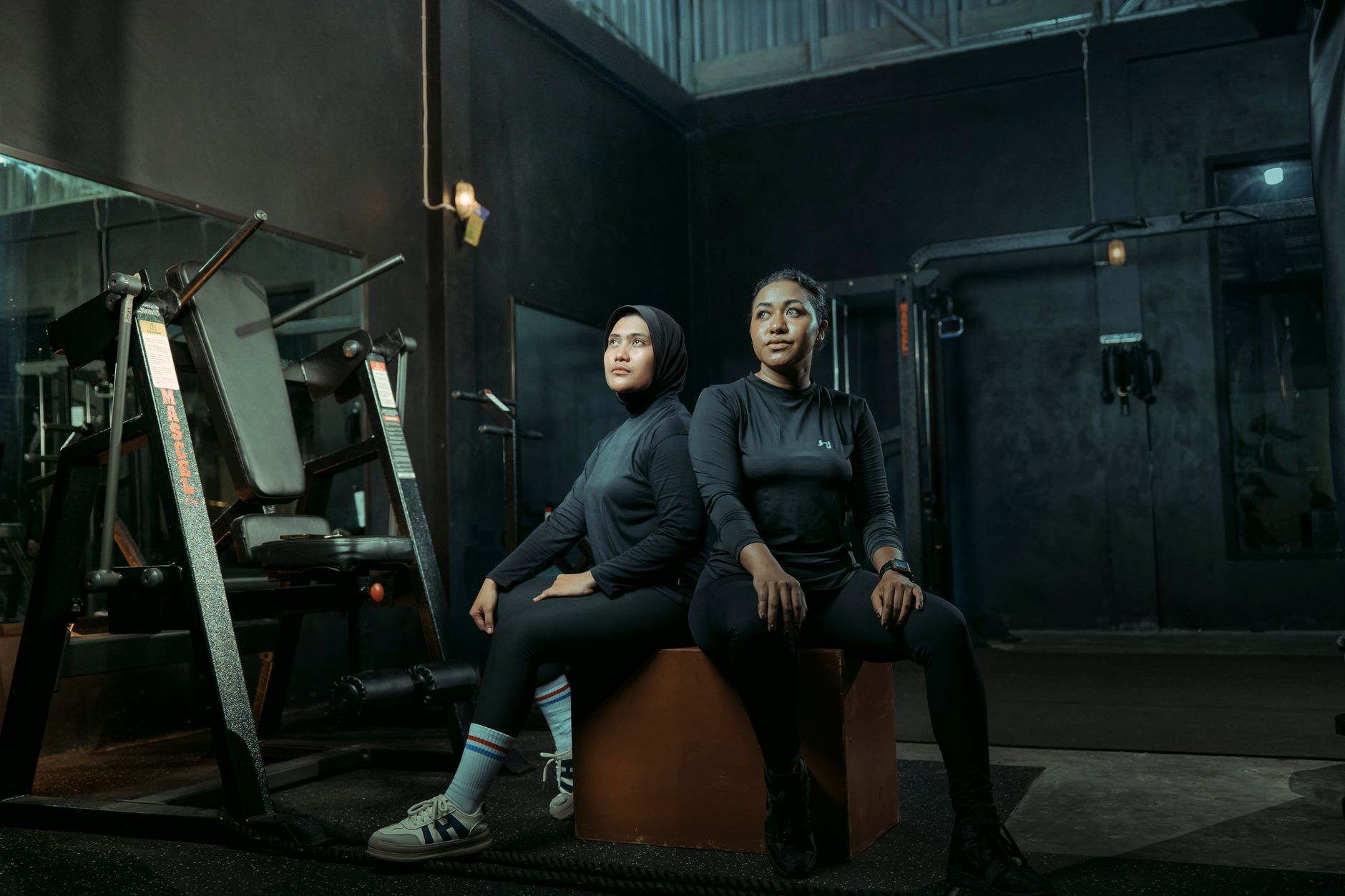 Women wearing stylish athletic wear in an urban outdoor setting