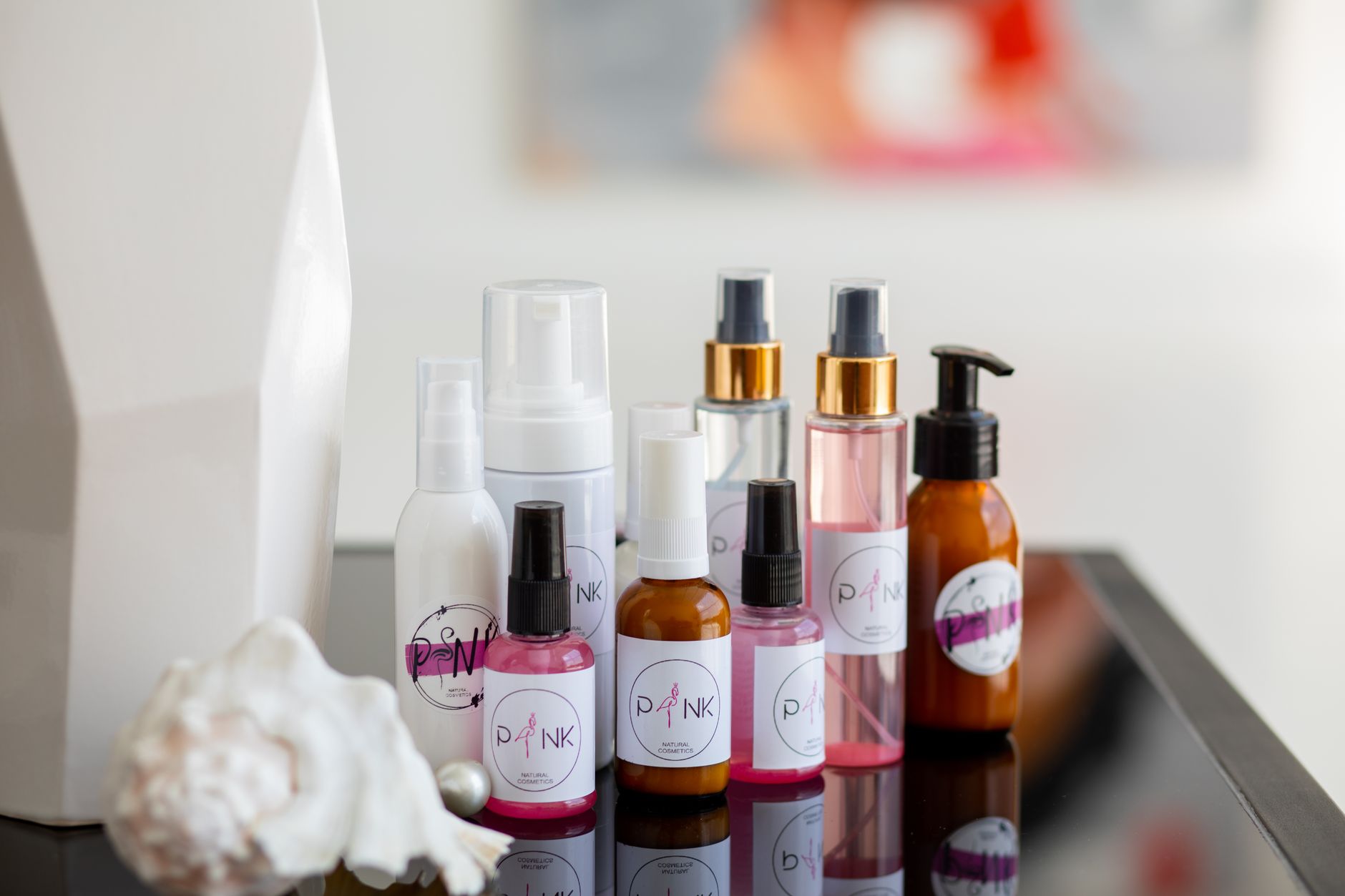 Assortment of skincare and beauty products laid out on a flat surface