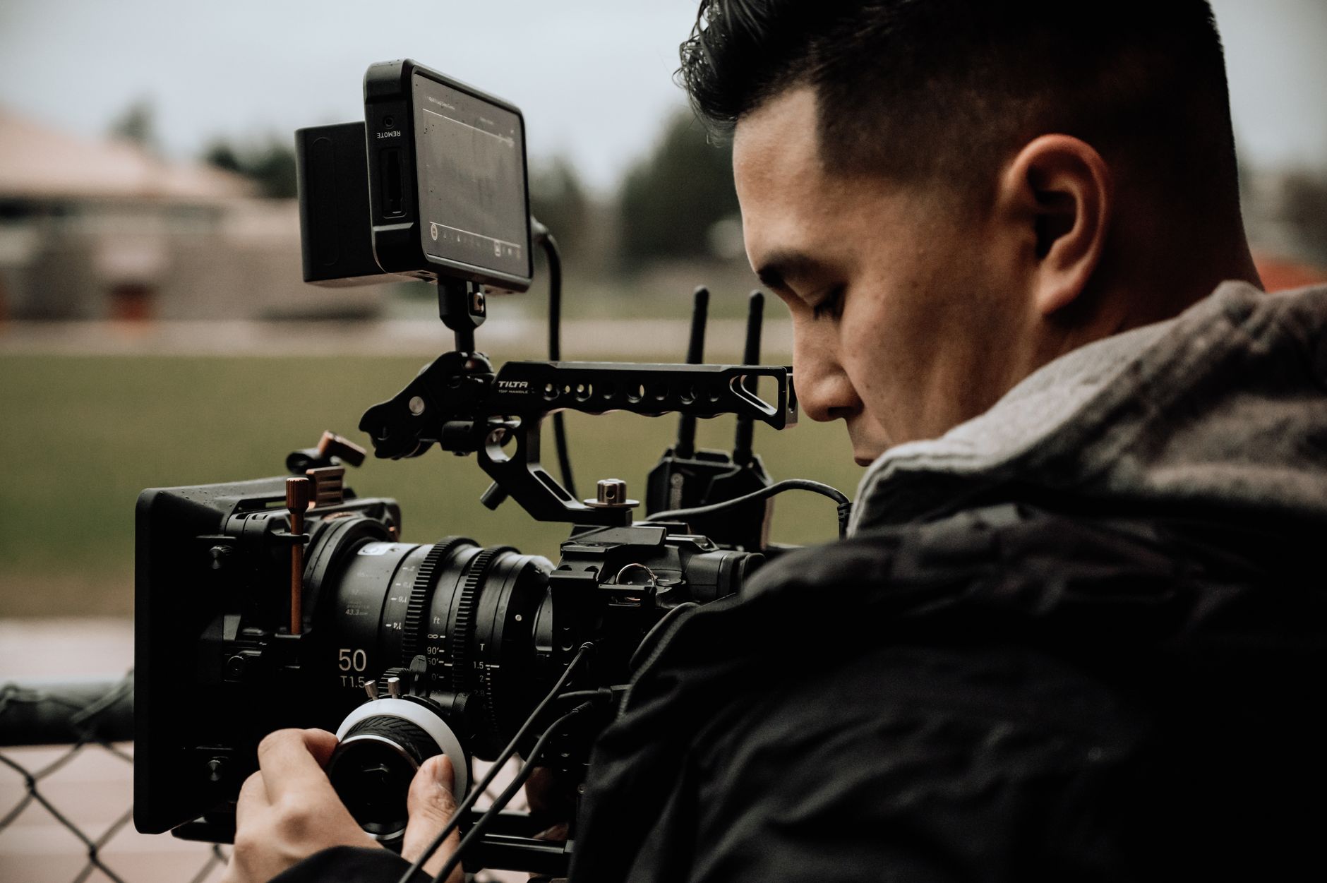 Behind-the-scenes action film production with crew and equipment