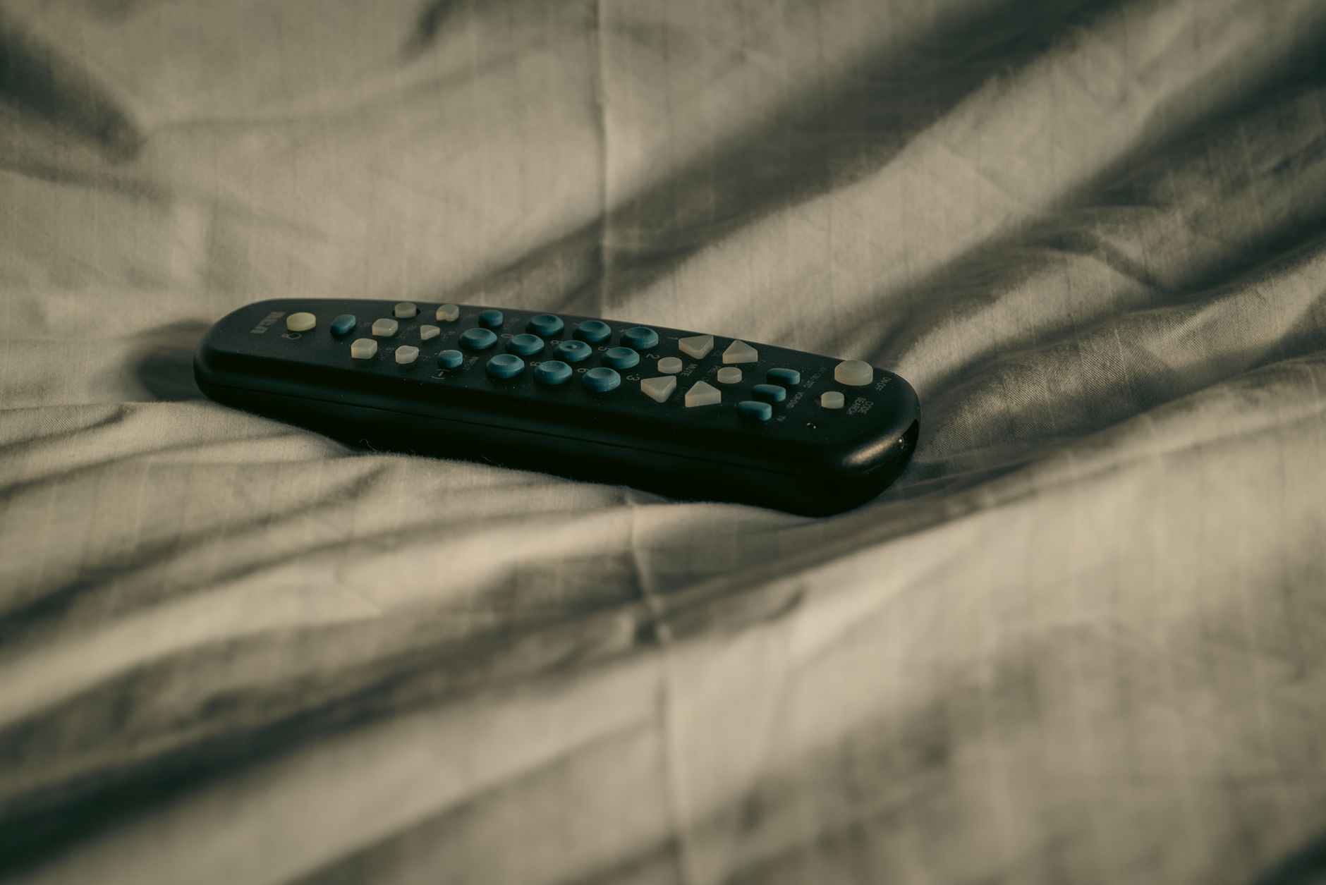 Person browsing a streaming service on a television screen at home