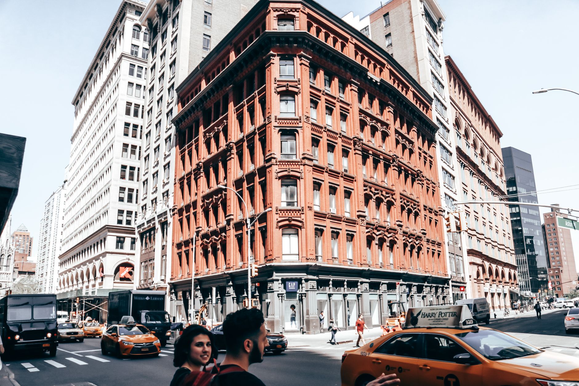 A busy Soho Manhattan street with pedestrians and boutique storefronts