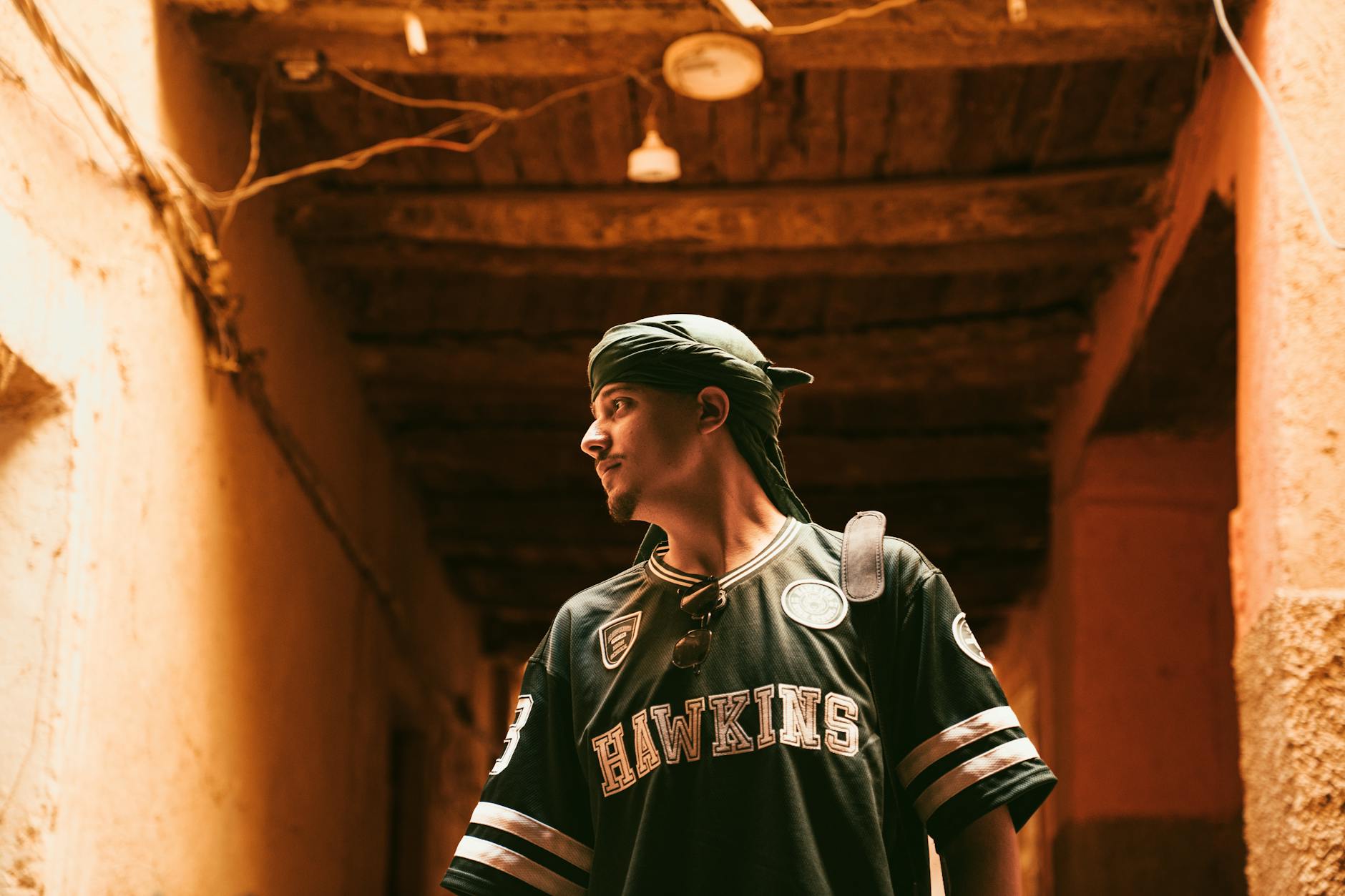 Upcycled vintage sports jersey hanging on a rack in an independent clothing store