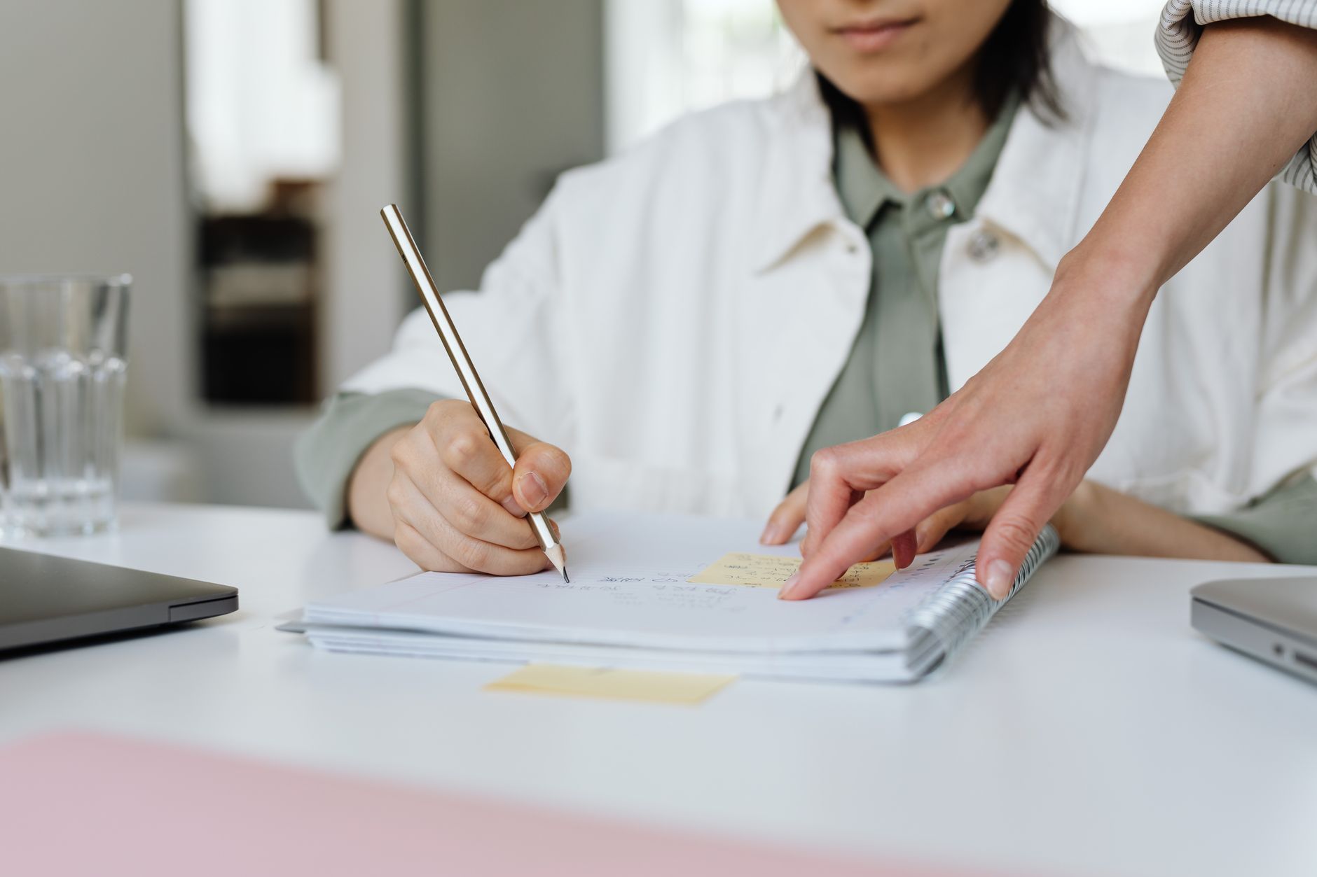 Open notebook with career planning notes and a pen beside a coffee cup