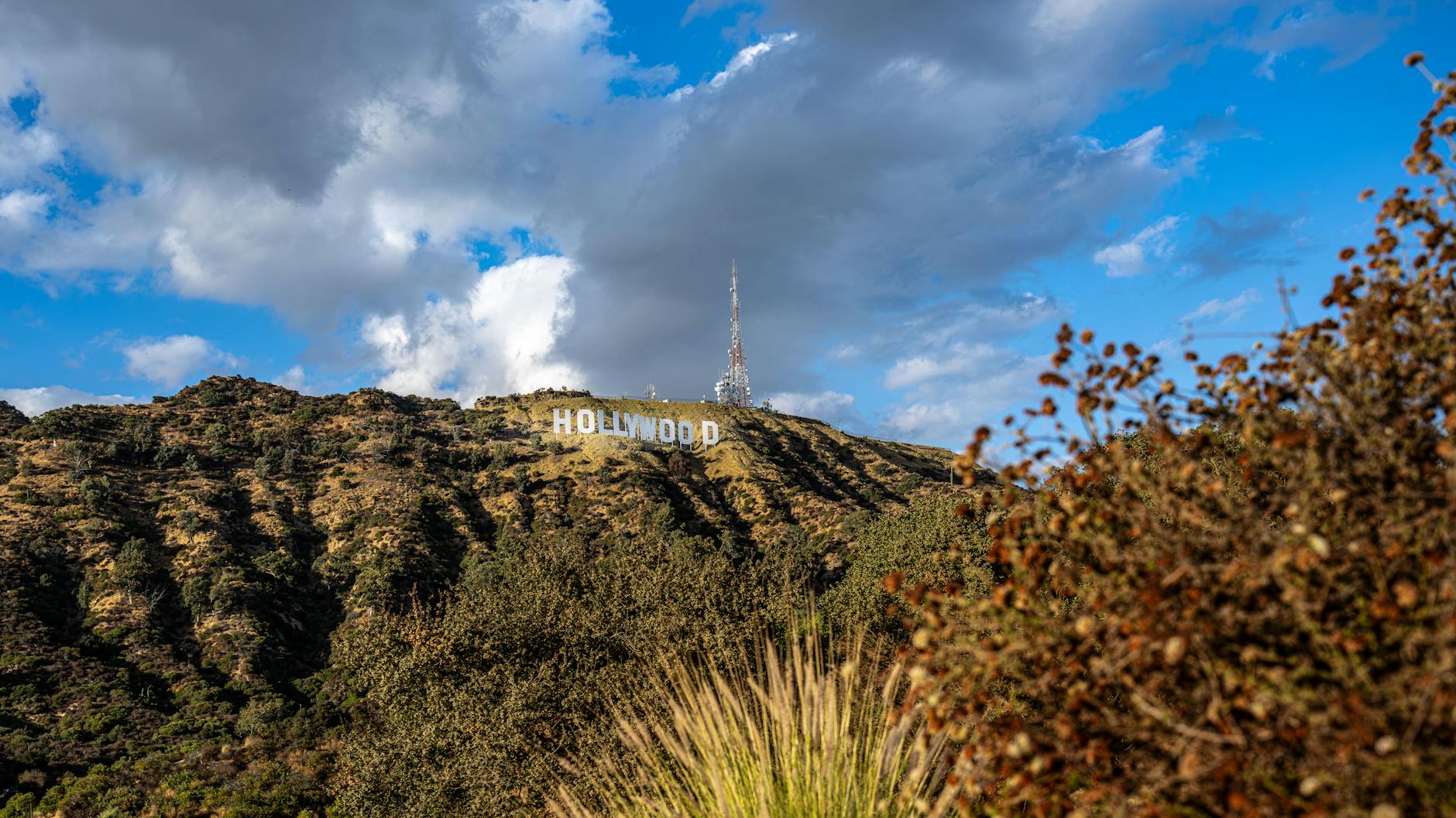 The Hollywood sign against a hazy Los Angeles skyline