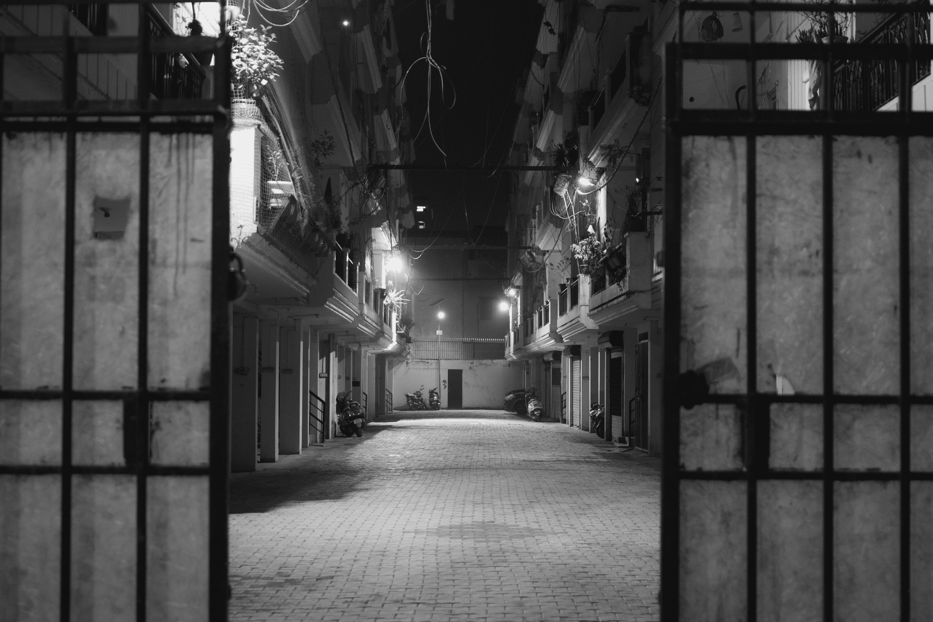 Dimly lit empty apartment interior at night with soft window light