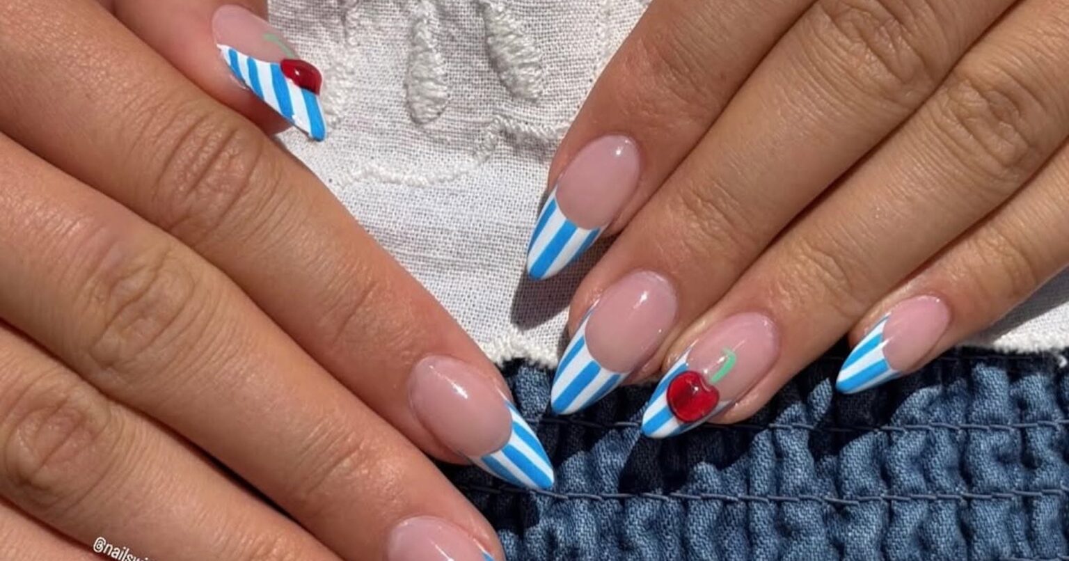 Fourth of July Nails That Close-up of a detailed nail manicure with red and white polka dot French tips