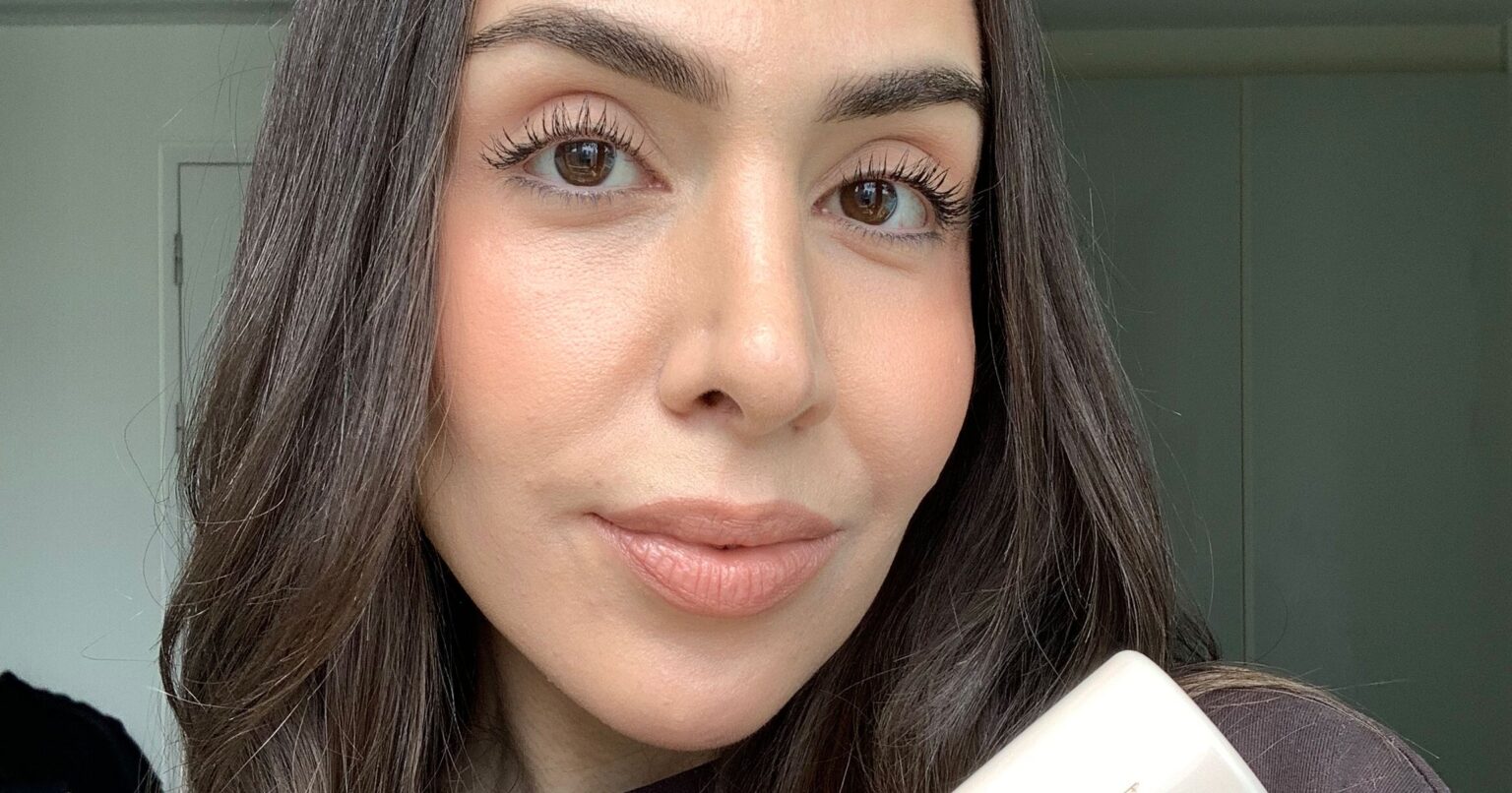 We Tried Tarte’s New CC Tinted Serum — & We’ll Be Using Every Last Drop A glass serum bottle on a clean white surface representing lightweight complexion products