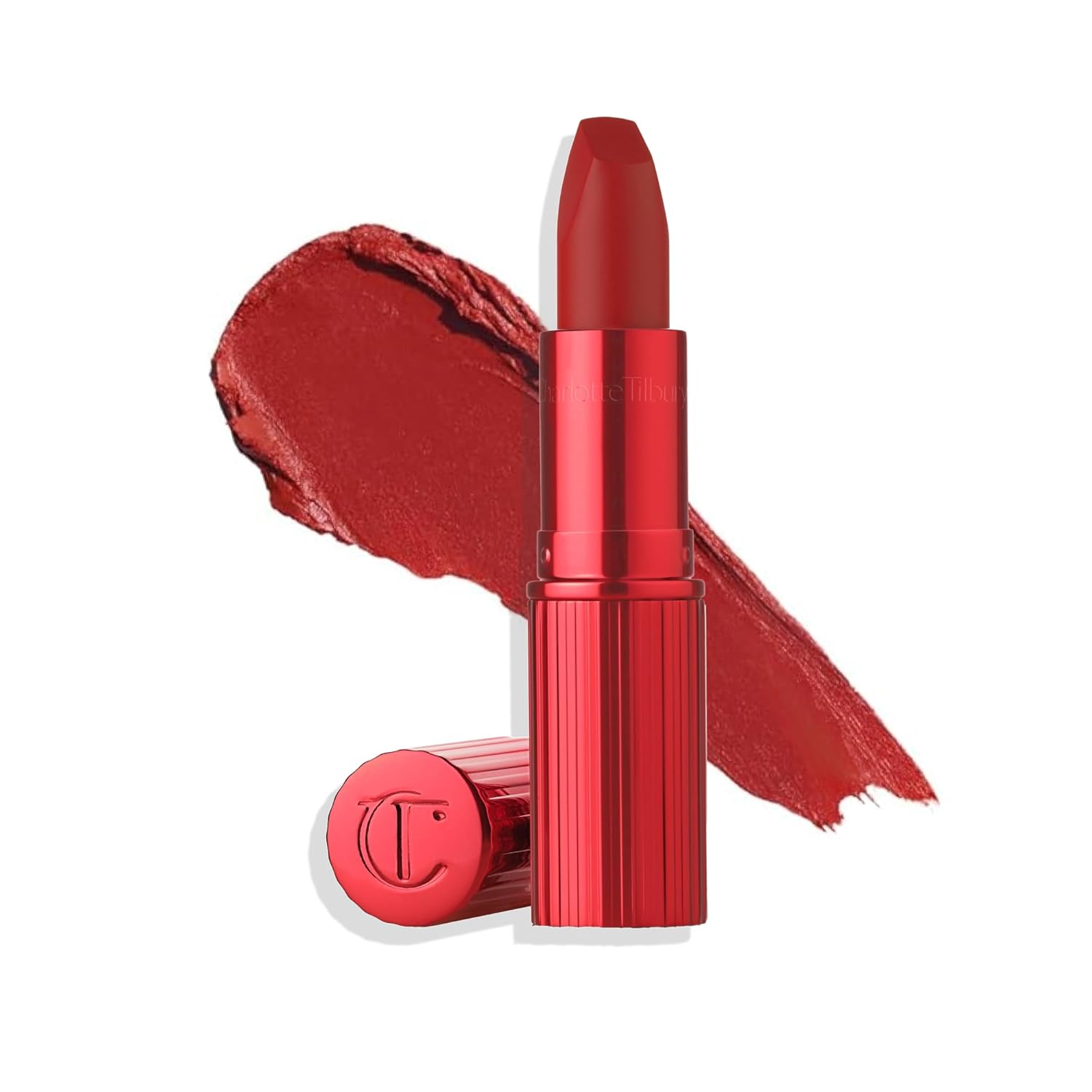 Woman carefully applying nude lipstick in natural light