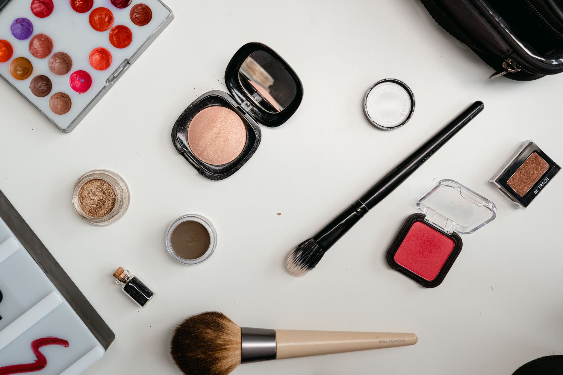 Close-up of bronzer stick being applied to skin with warm summer light
