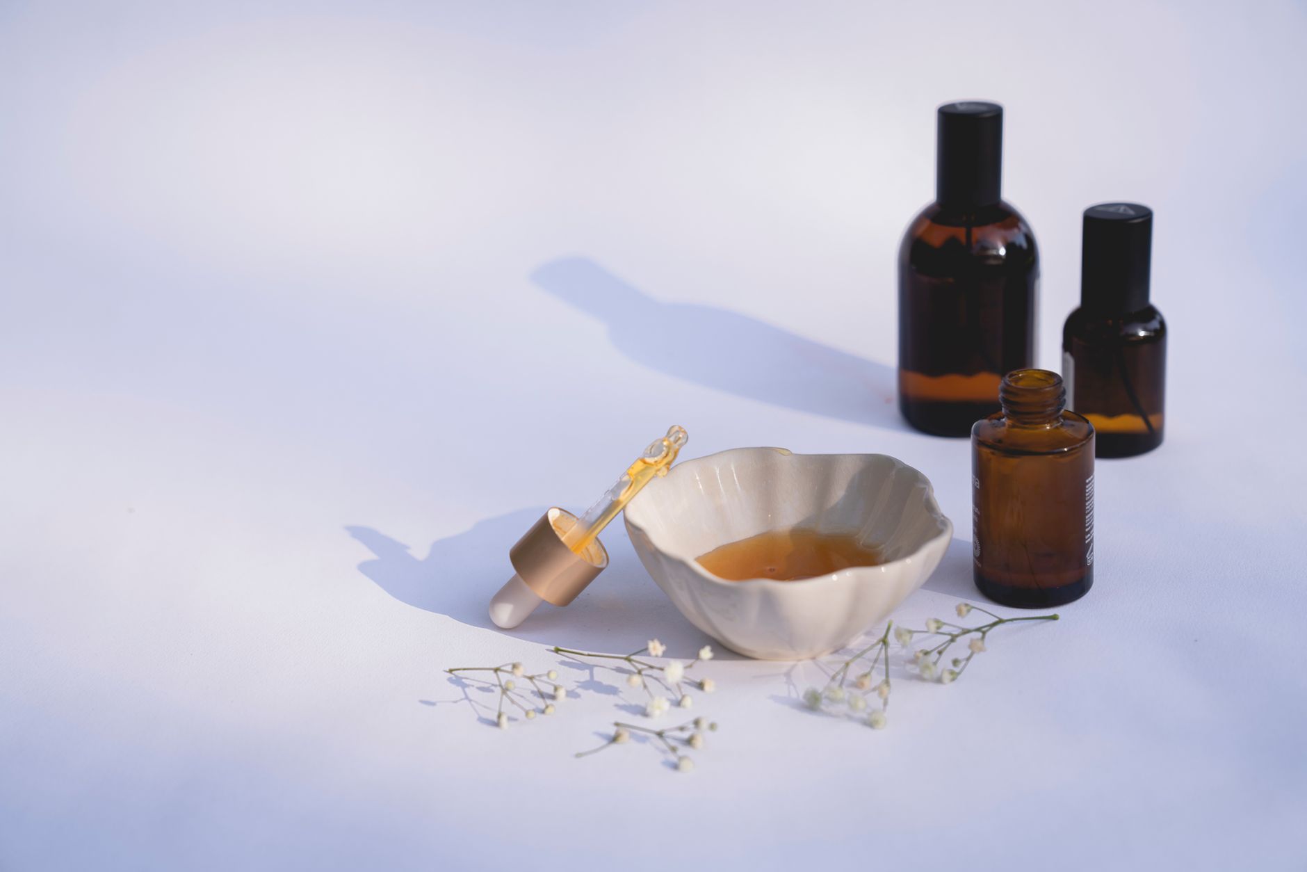 Skincare cream products arranged on a white surface showing ingredient labels