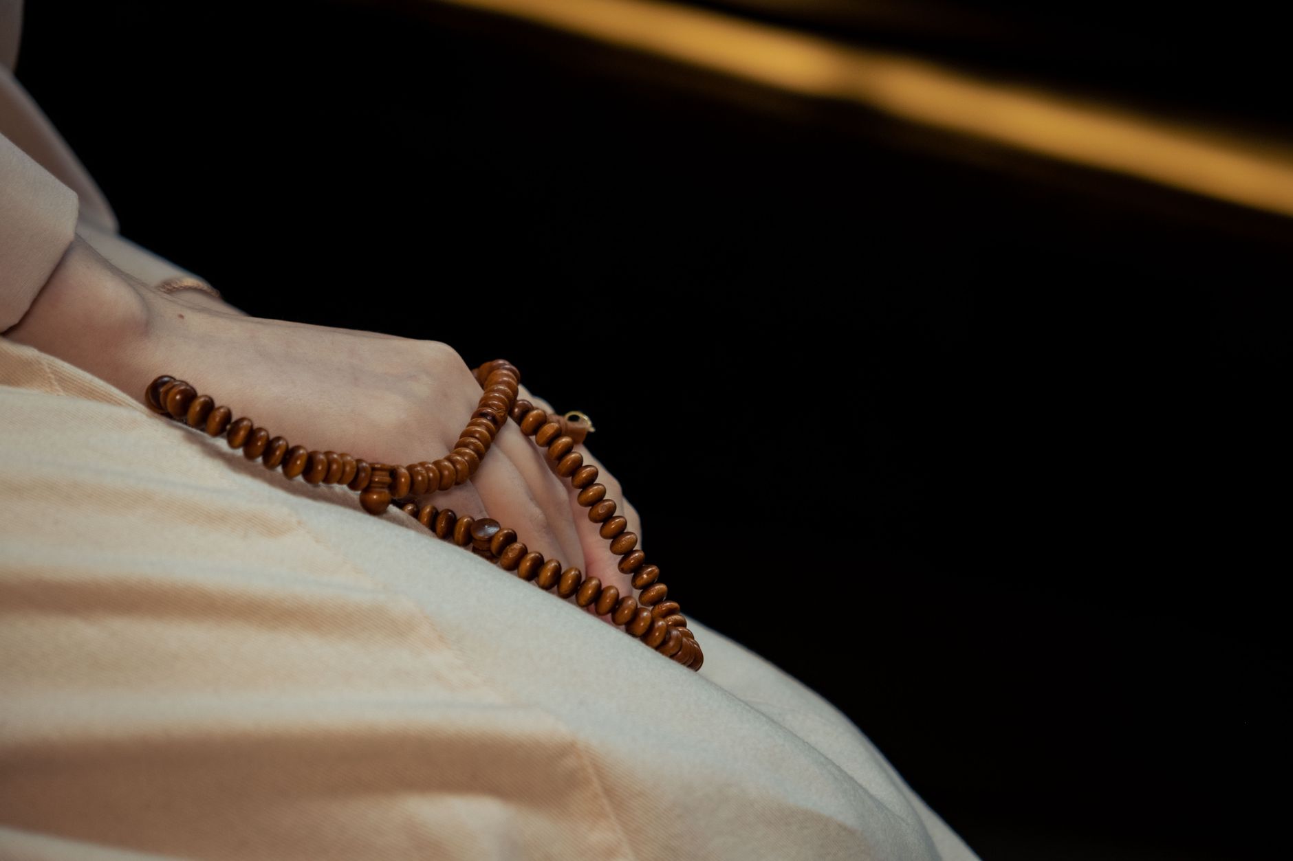 Muslim woman's hands resting during prayer