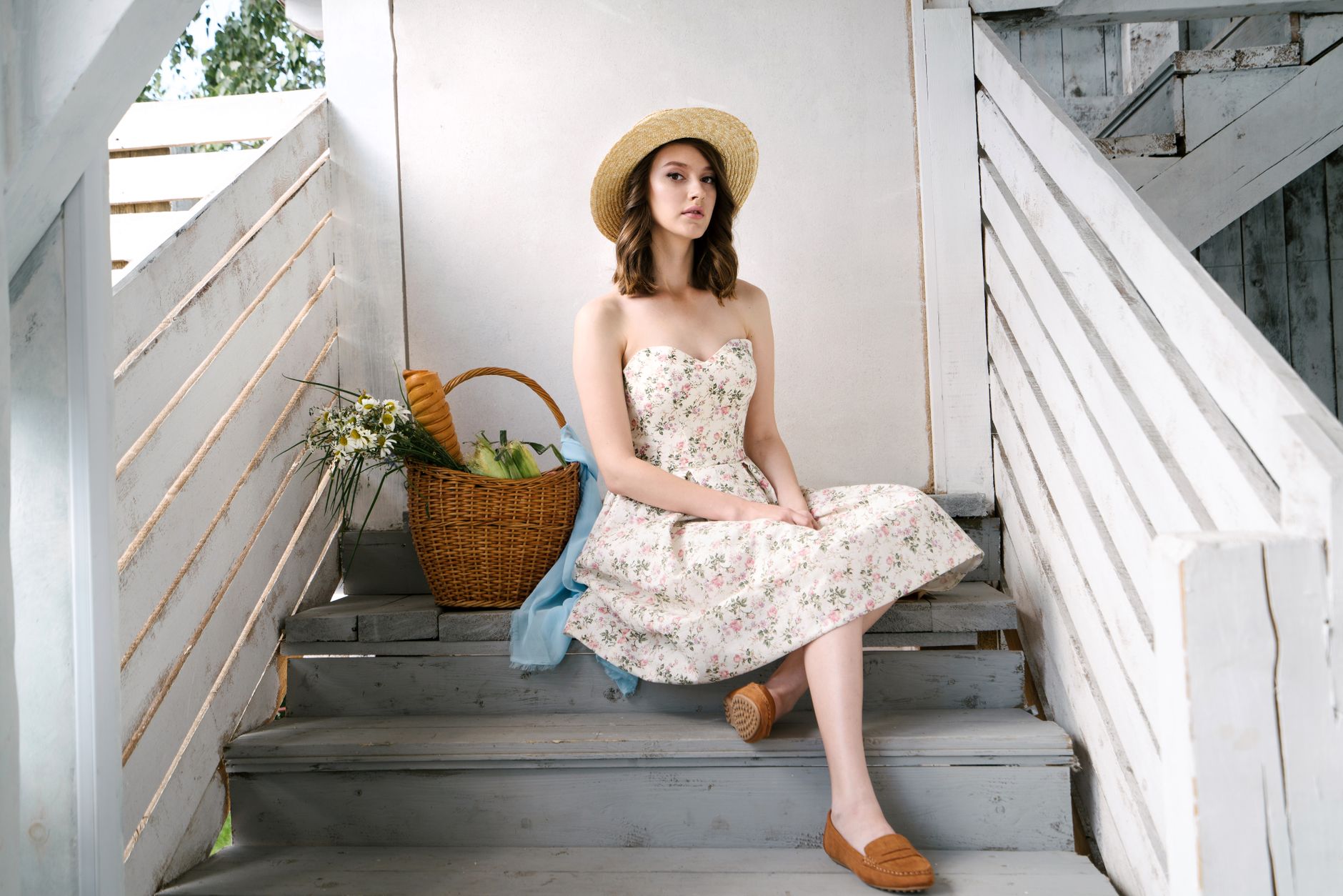 Woman wearing a midi-length dress outdoors in summer light