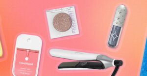 Assorted beauty and hair care products arranged on a flat surface