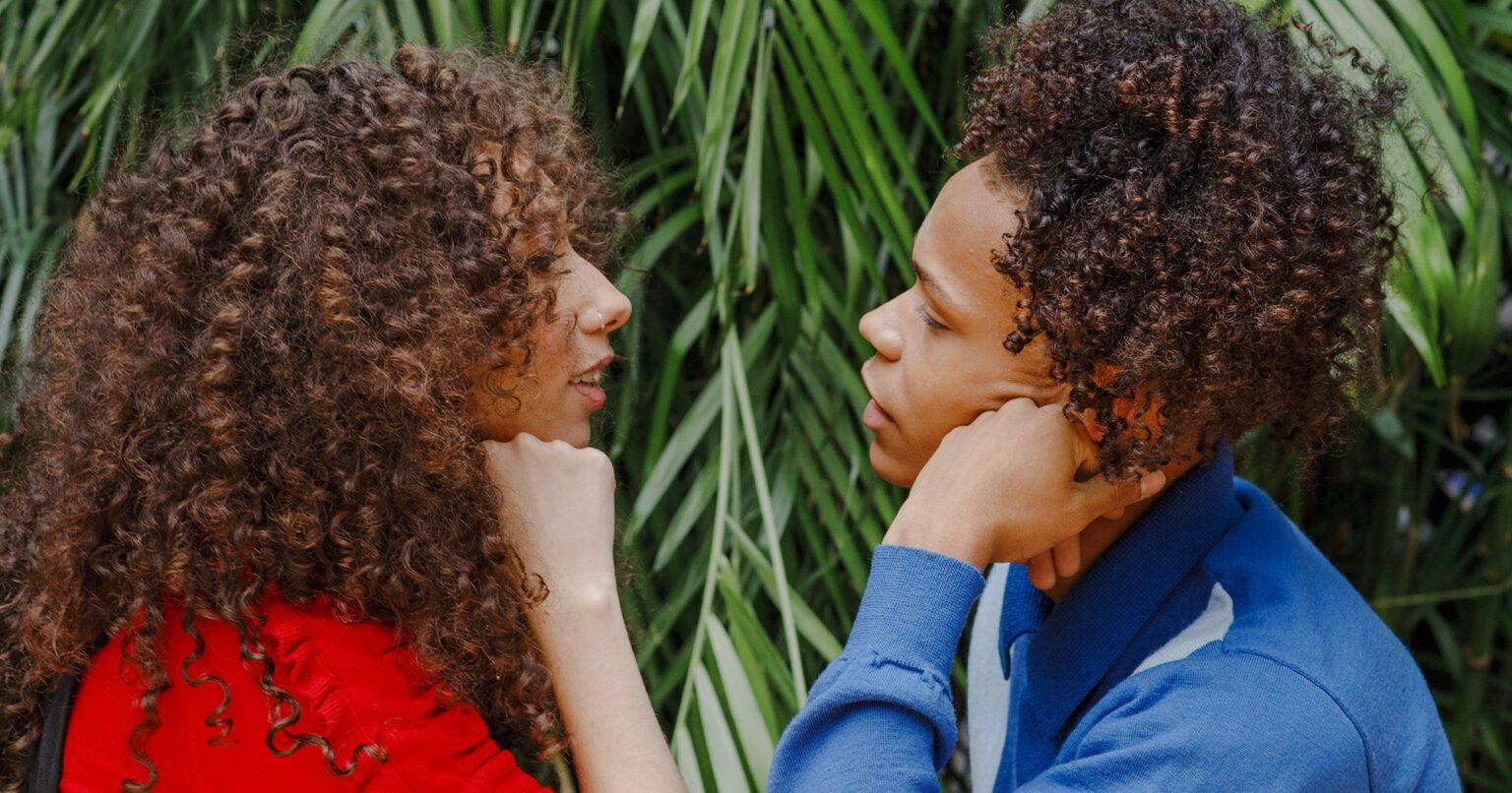 Most Couples Never Swiped: Where Real People Actually Meet Two women smiling and talking over coffee at a casual indoor gathering