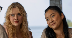 Lana Condor and Kathryn Newton Are Surviving Sharks and Industry Gaps Dark ocean waves with light breaking through the surface, evoking tension and survival
