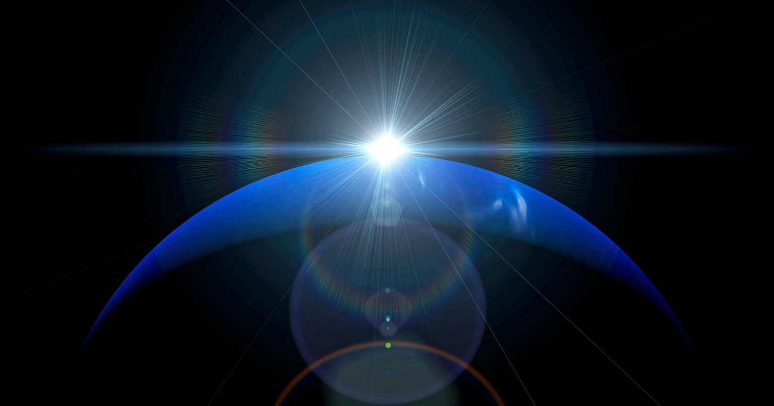 Deep blue night sky with glowing planet visible above the horizon