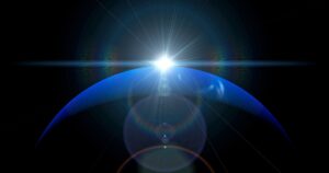 Neptune Goes Retrograde in Aries for Five Months Starting July Deep blue night sky with glowing planet visible above the horizon
