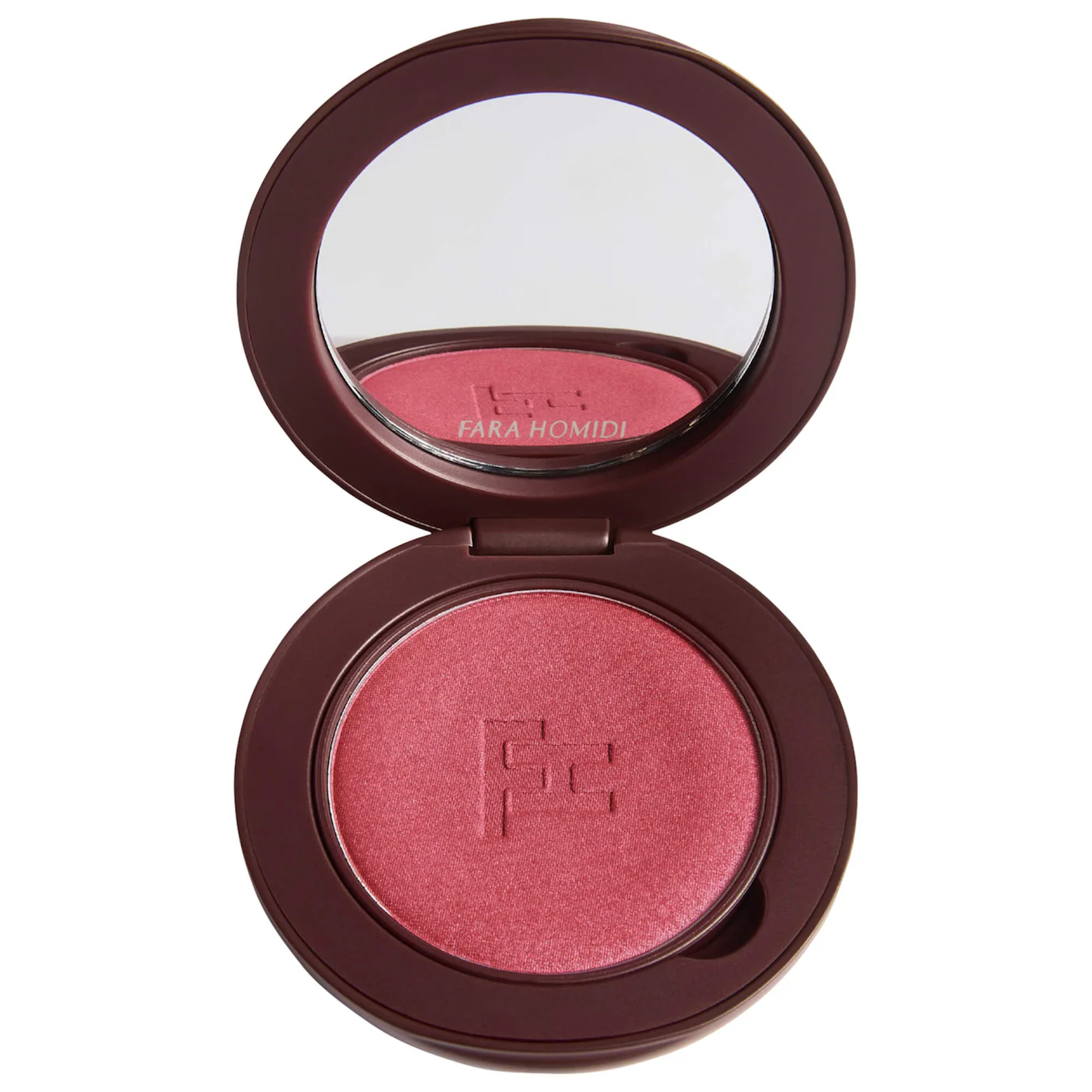Flatlay of summer makeup products including blush compact and bronzer on a vanity surface
