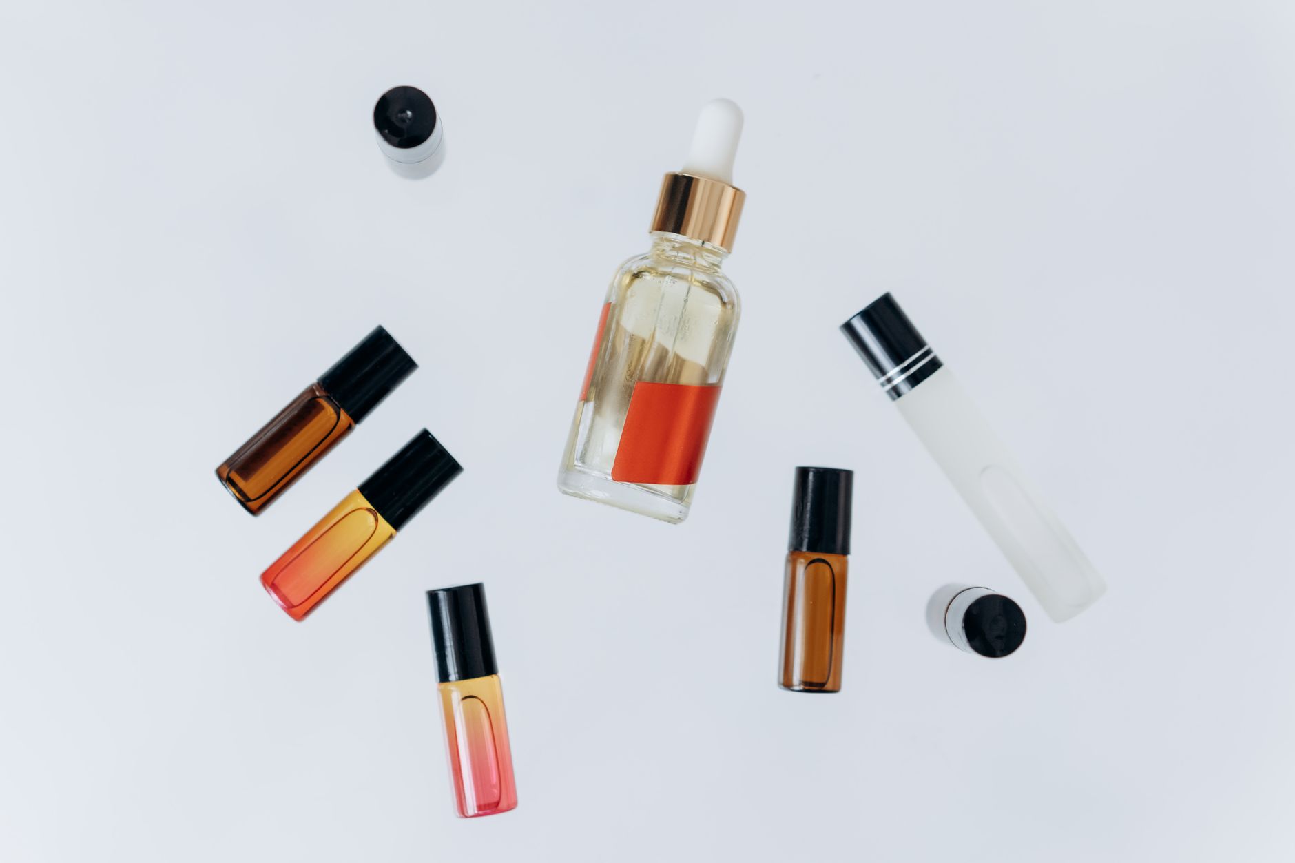 Minimalist perfume bottles arranged on a marble surface