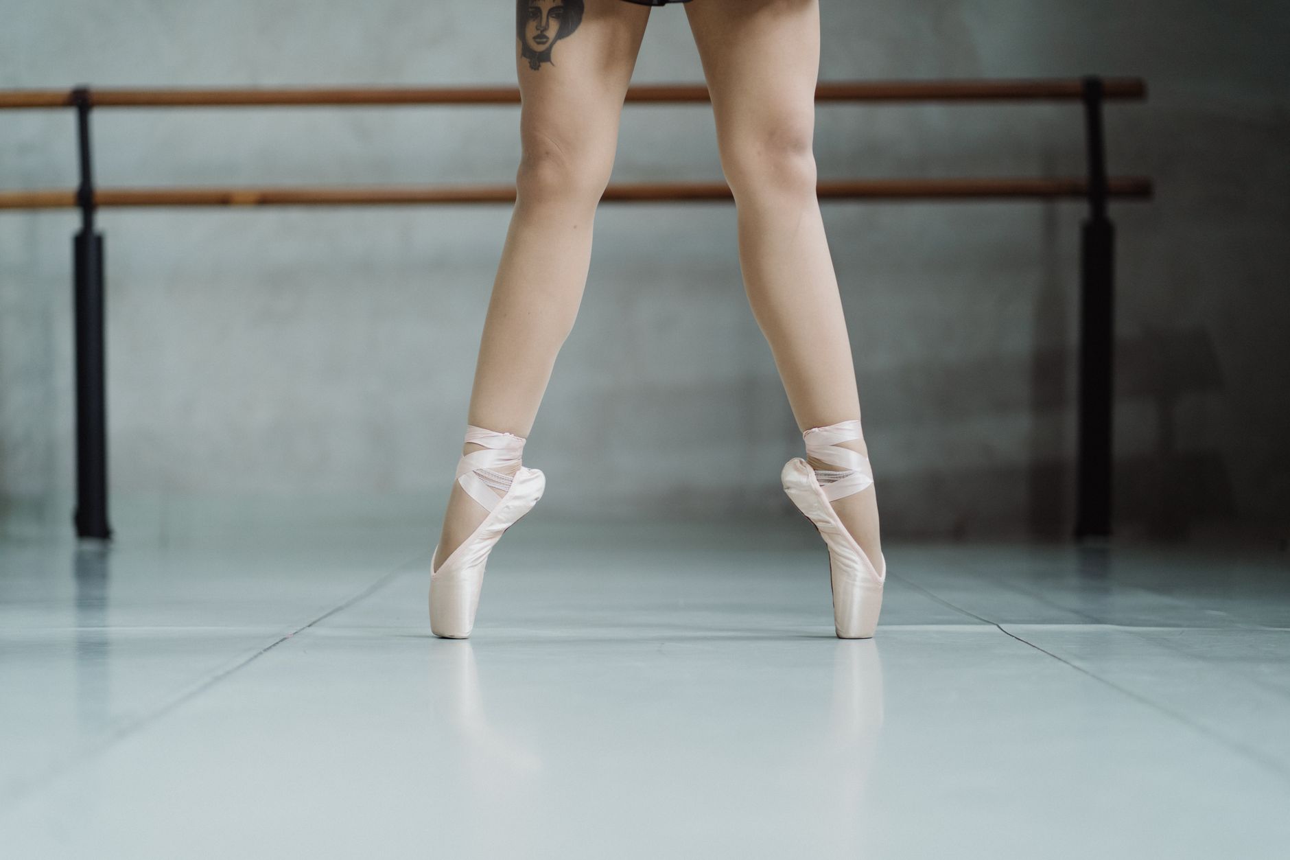 Close-up of low ballet heels on a wooden floor