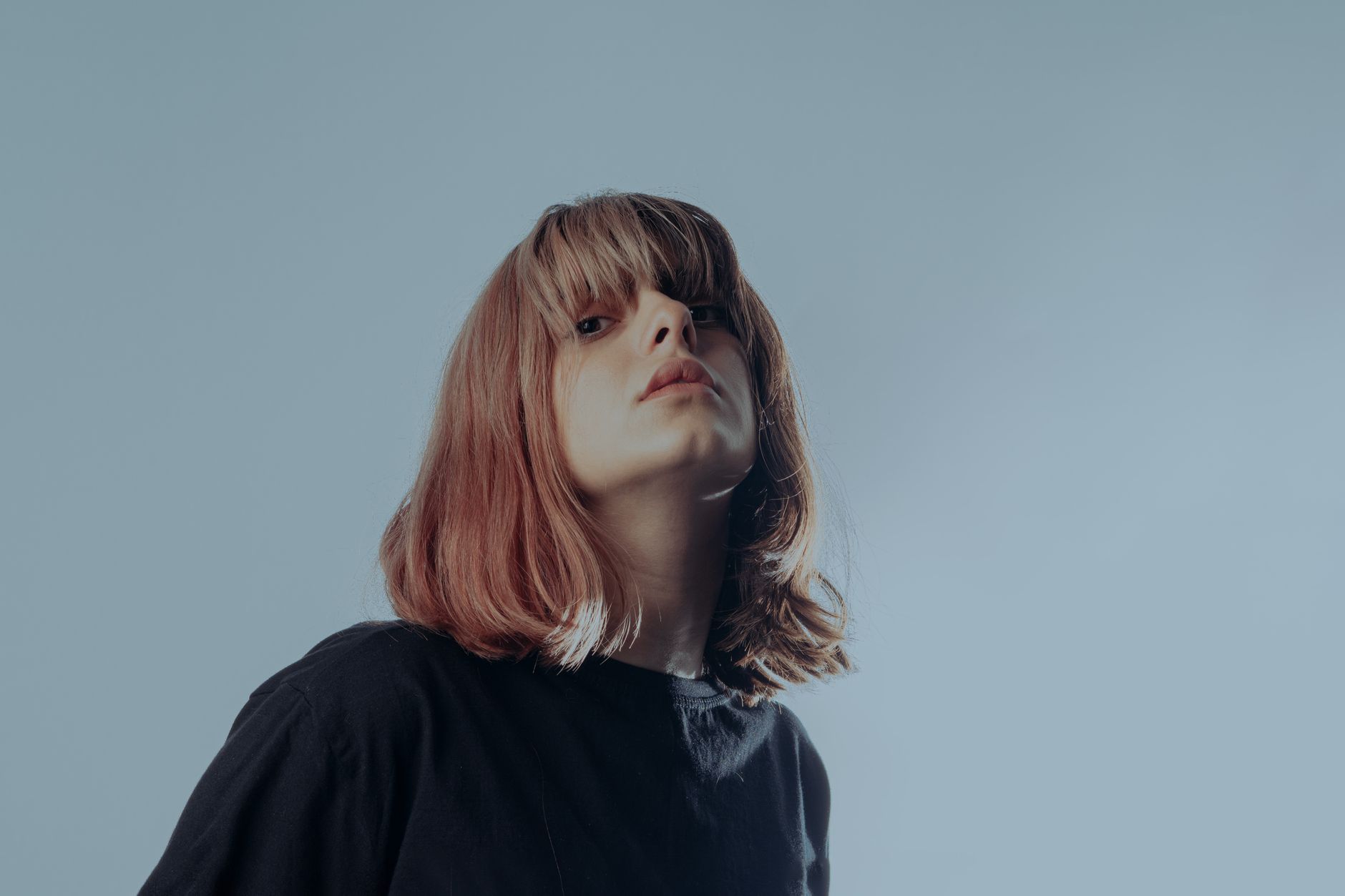Close-up of a blunt bob haircut with sharp edges and face-framing layers