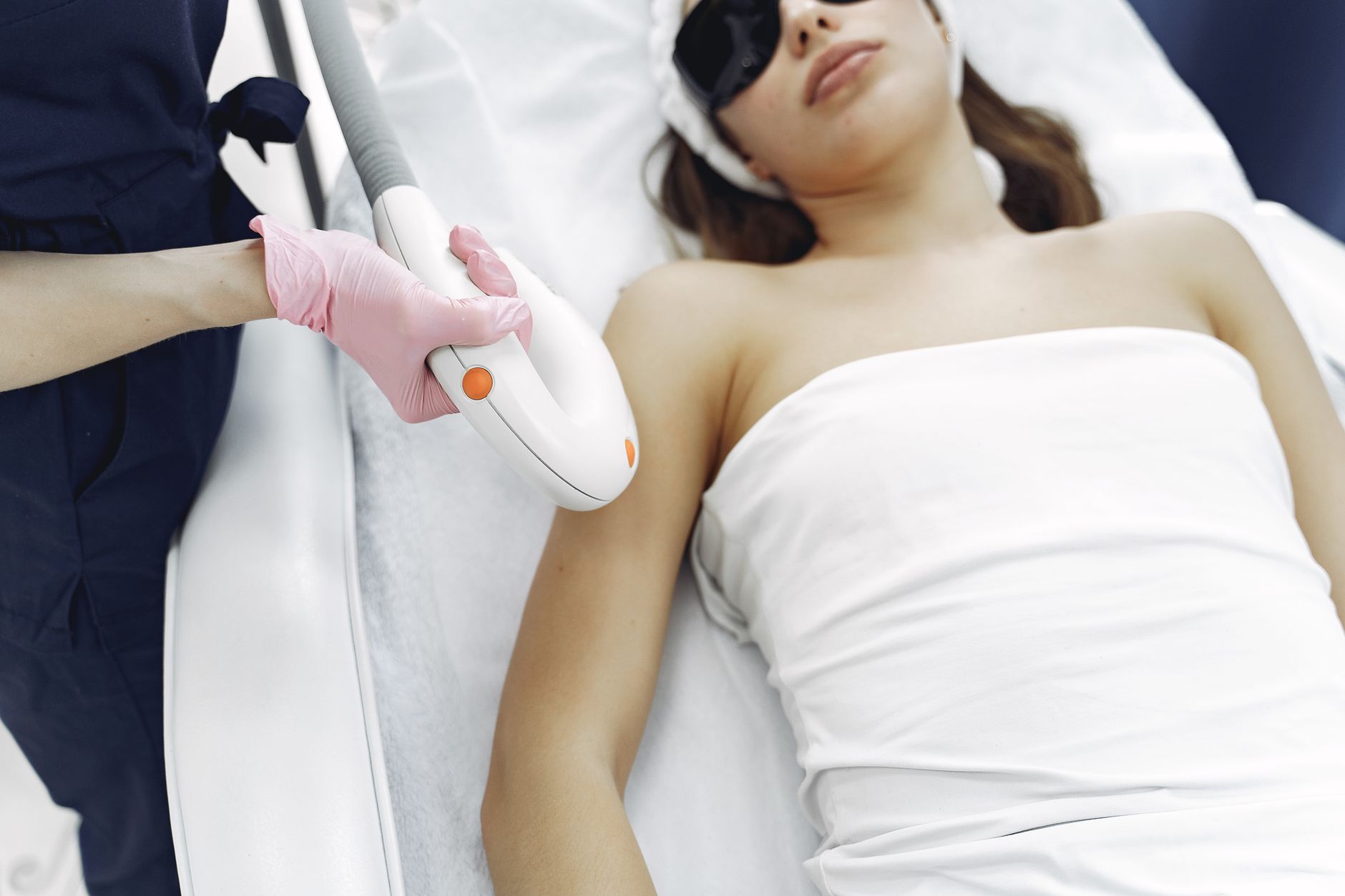 A professional laser treatment being administered in a clinical setting