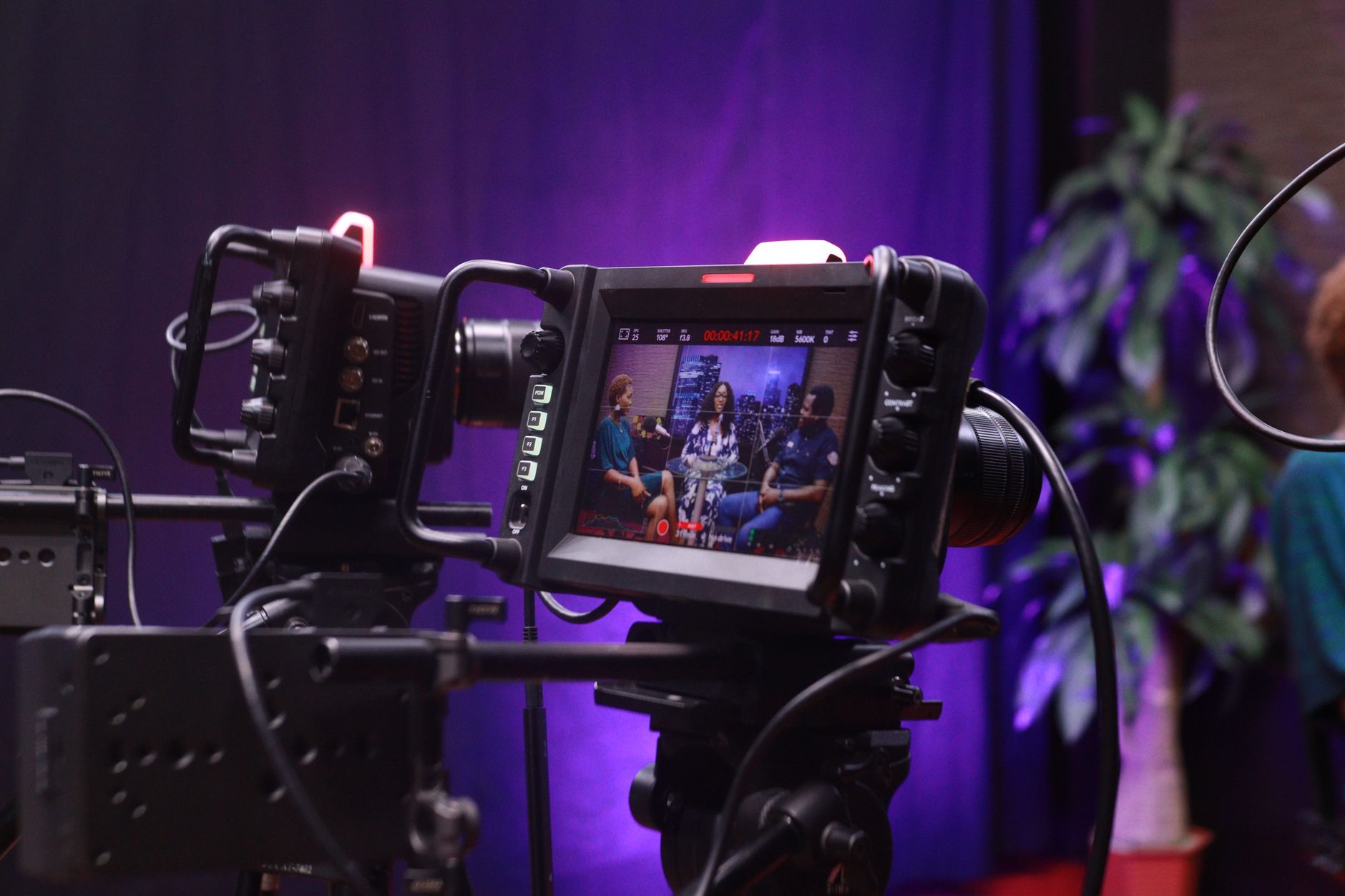 Two actors speaking during a press junket interview setting
