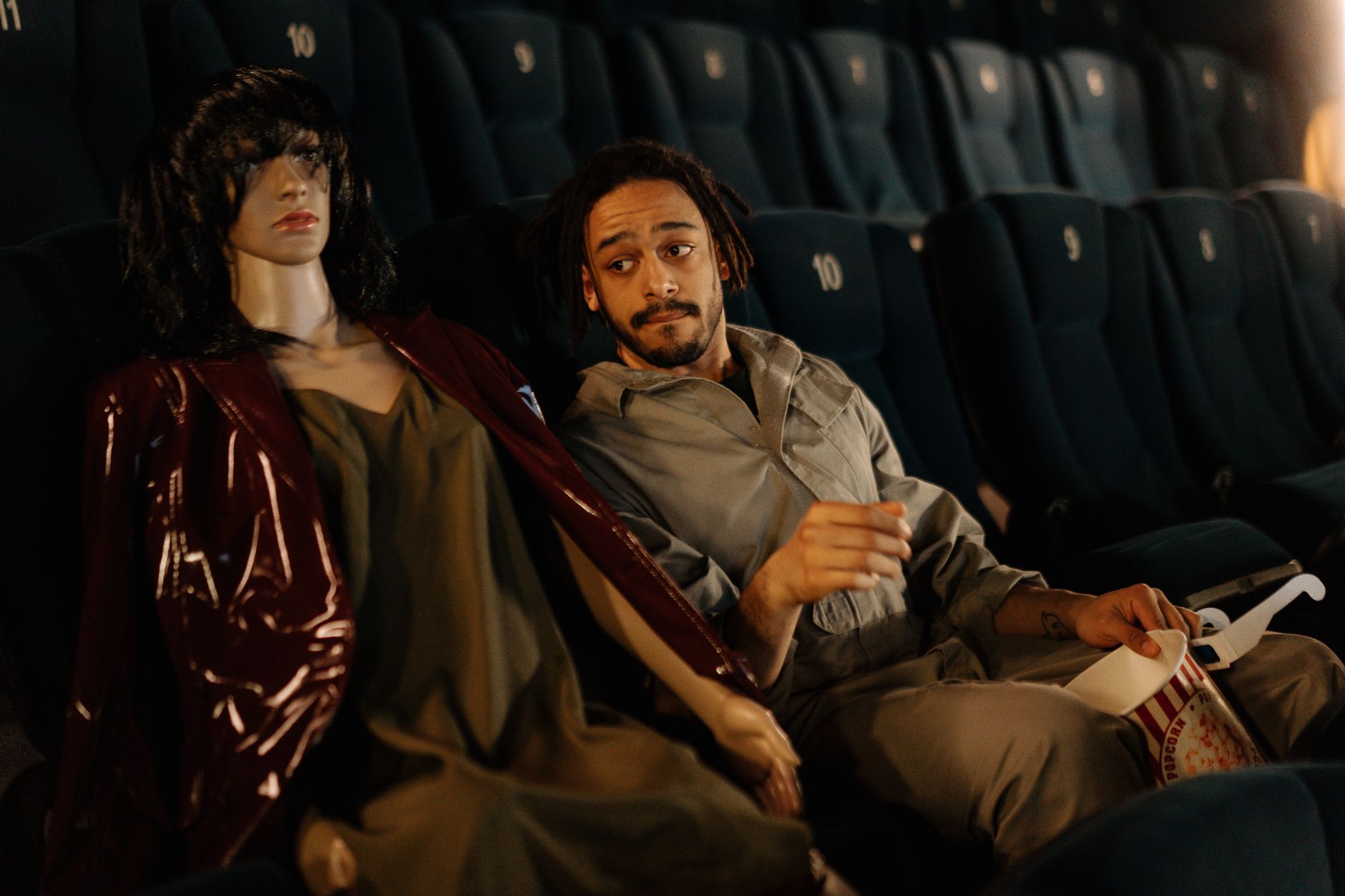Couple watching a film in a darkened movie theater