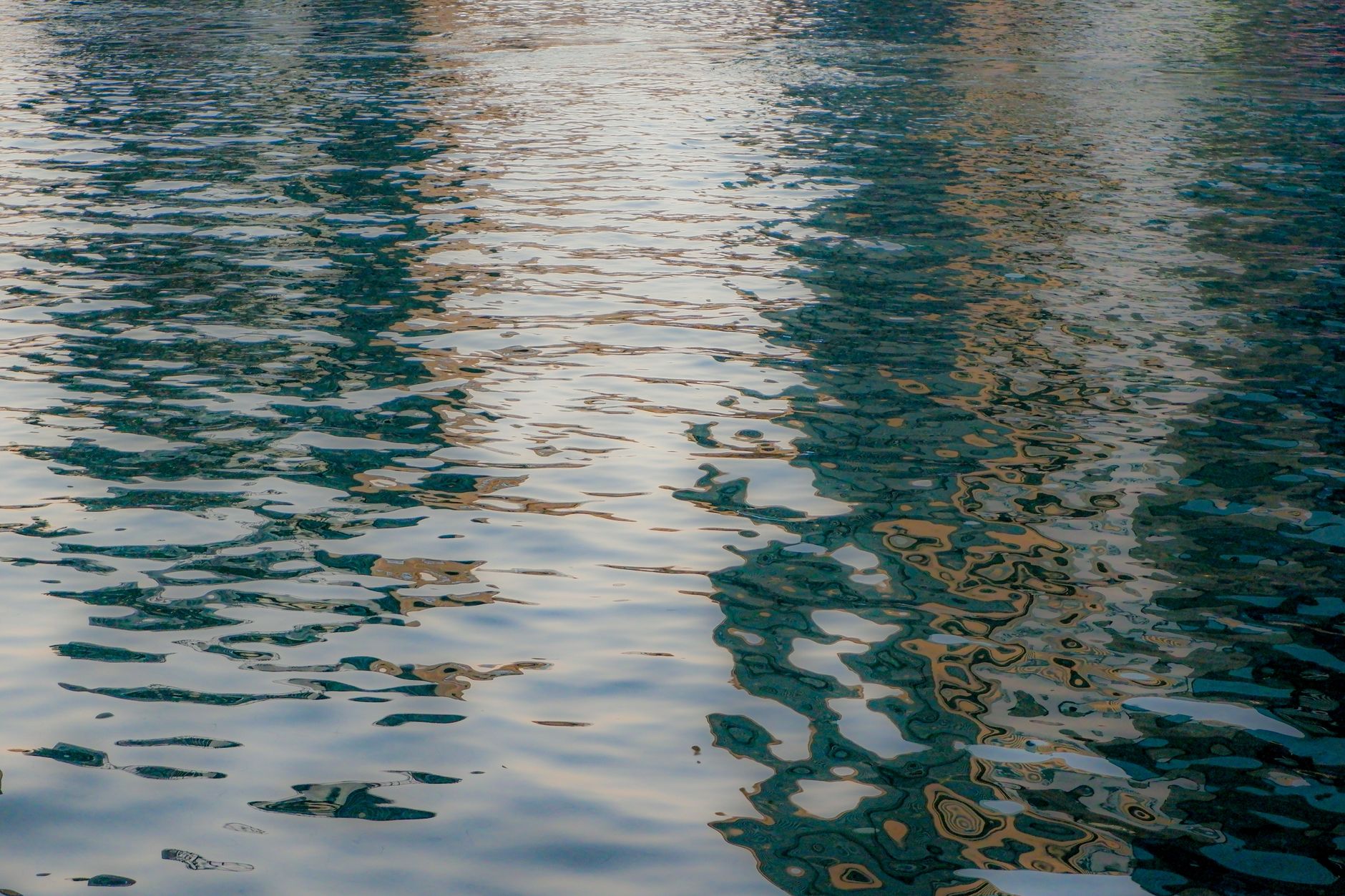 Still water surface with reflection symbolizing emotional depth and intuition