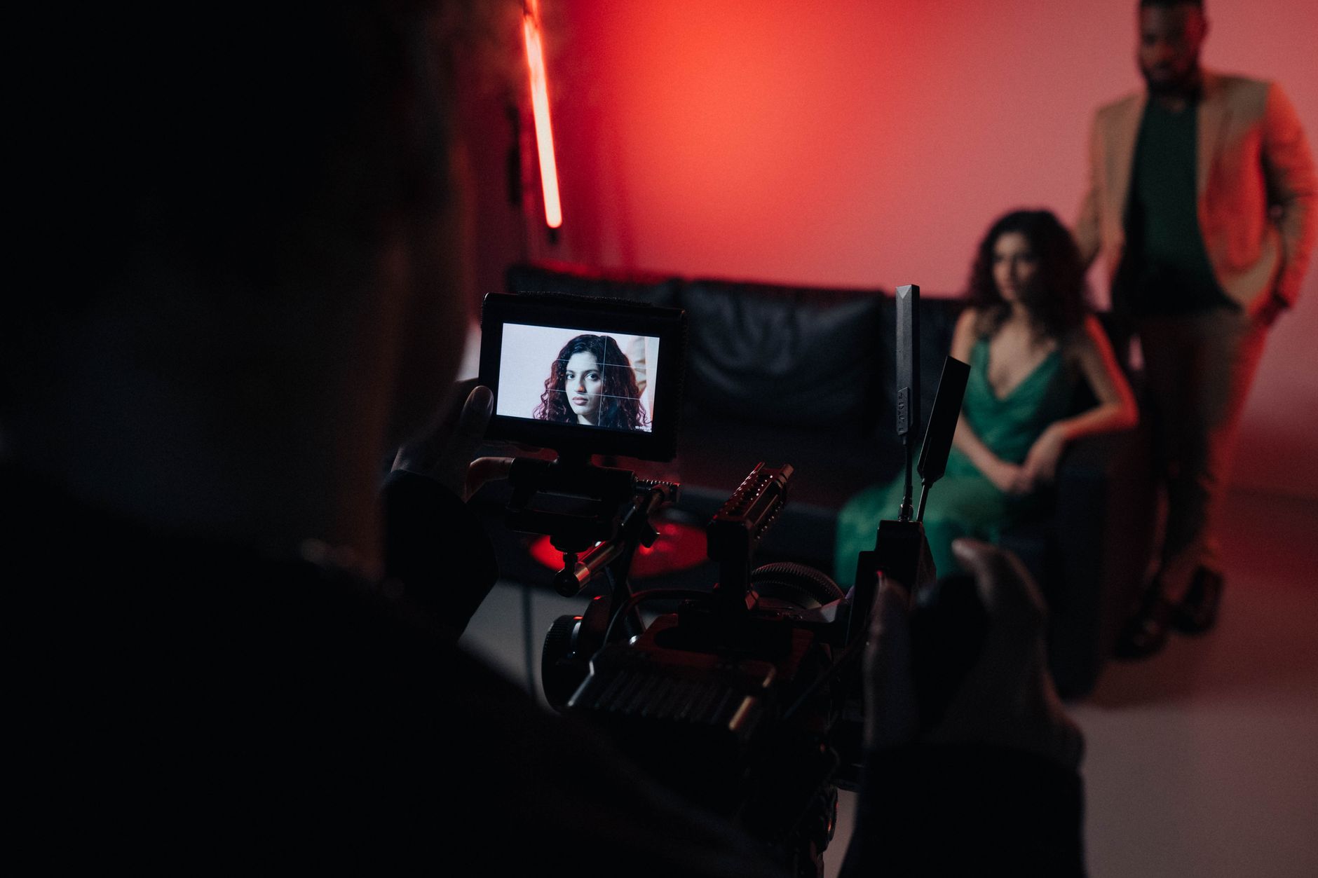 A director reviewing a scene on set, representing Megan Park's approach to storytelling