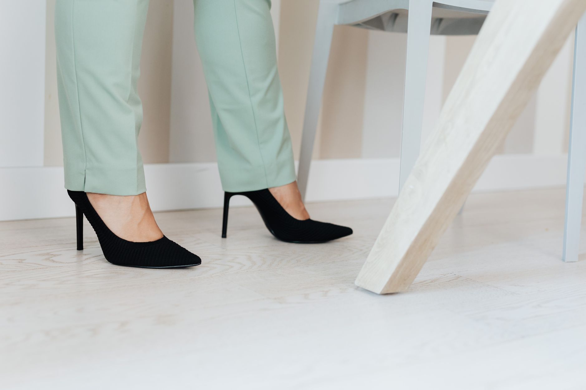 Pointed-toe kitten heels worn as part of a mixed-register fall outfit