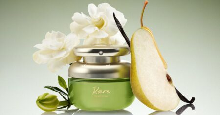 Rare Beauty’s New Rare Beginnings Perfume Reviewed: Is It Worth Buying? Close-up of a sage-green perfume bottle on a marble surface