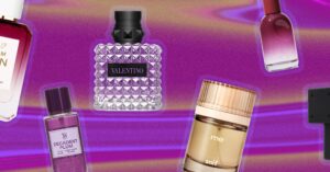 Plum Is the Fall Fragrance Note Replacing Your Berry Spritz Fresh dark plums on a wooden surface, rich and deep in color