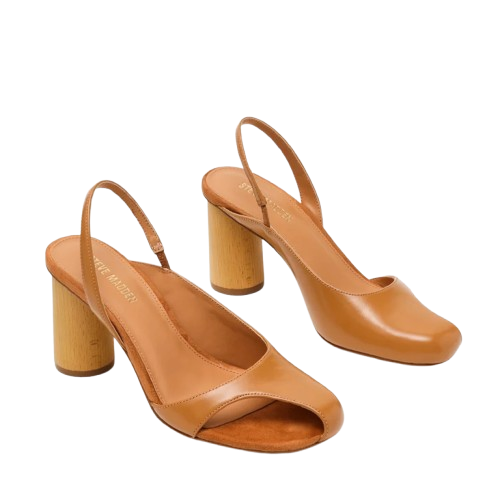 Close-up of open-toe sandals on a woman's feet against a light background