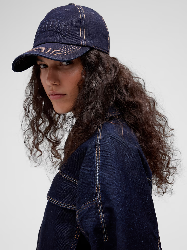 Person styled in utilitarian fall workwear with structured denim separates