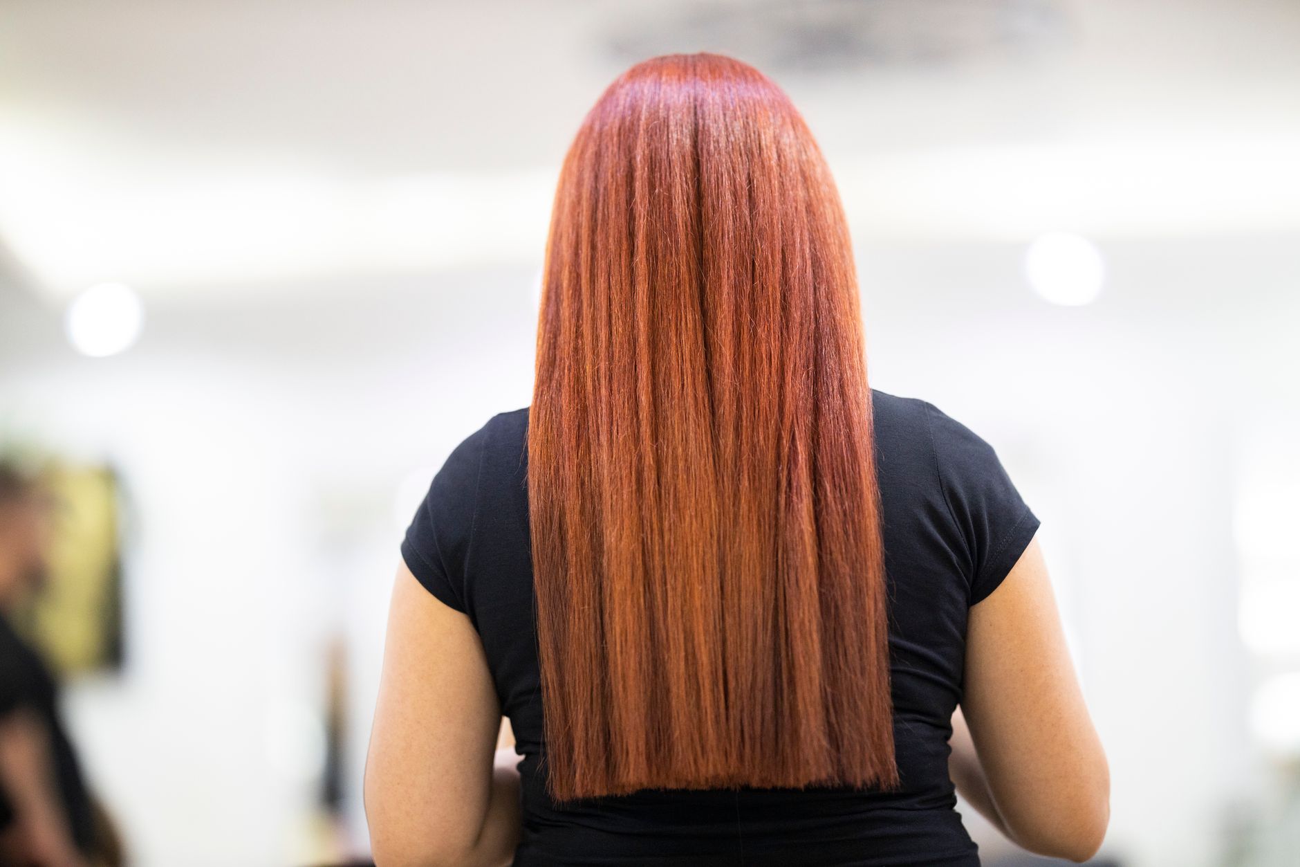 Close-up of glossy, polished hair with soft layers and natural movement