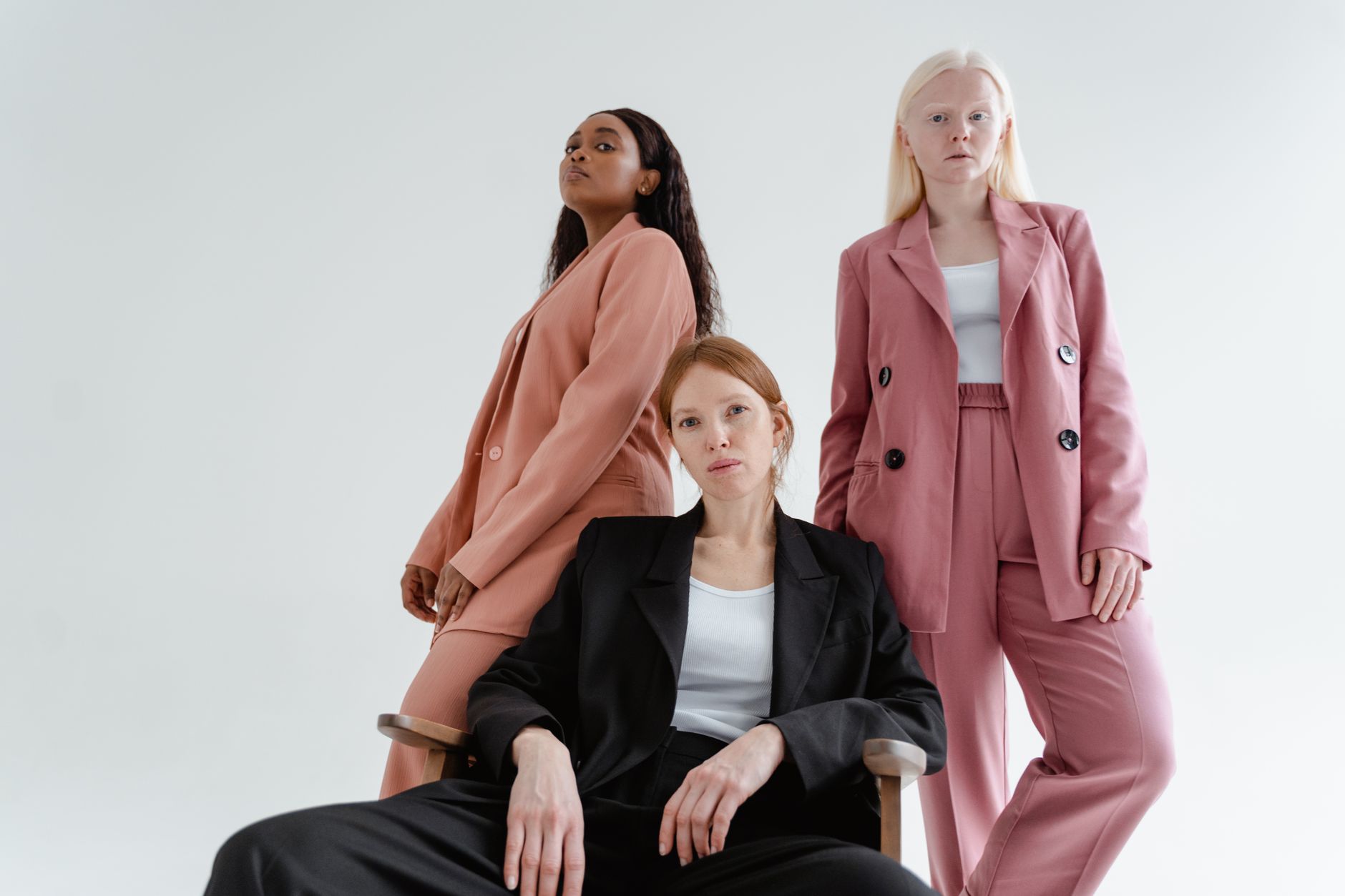 A woman in a well-fitted blazer and skirt combination reflecting refined, effortless style