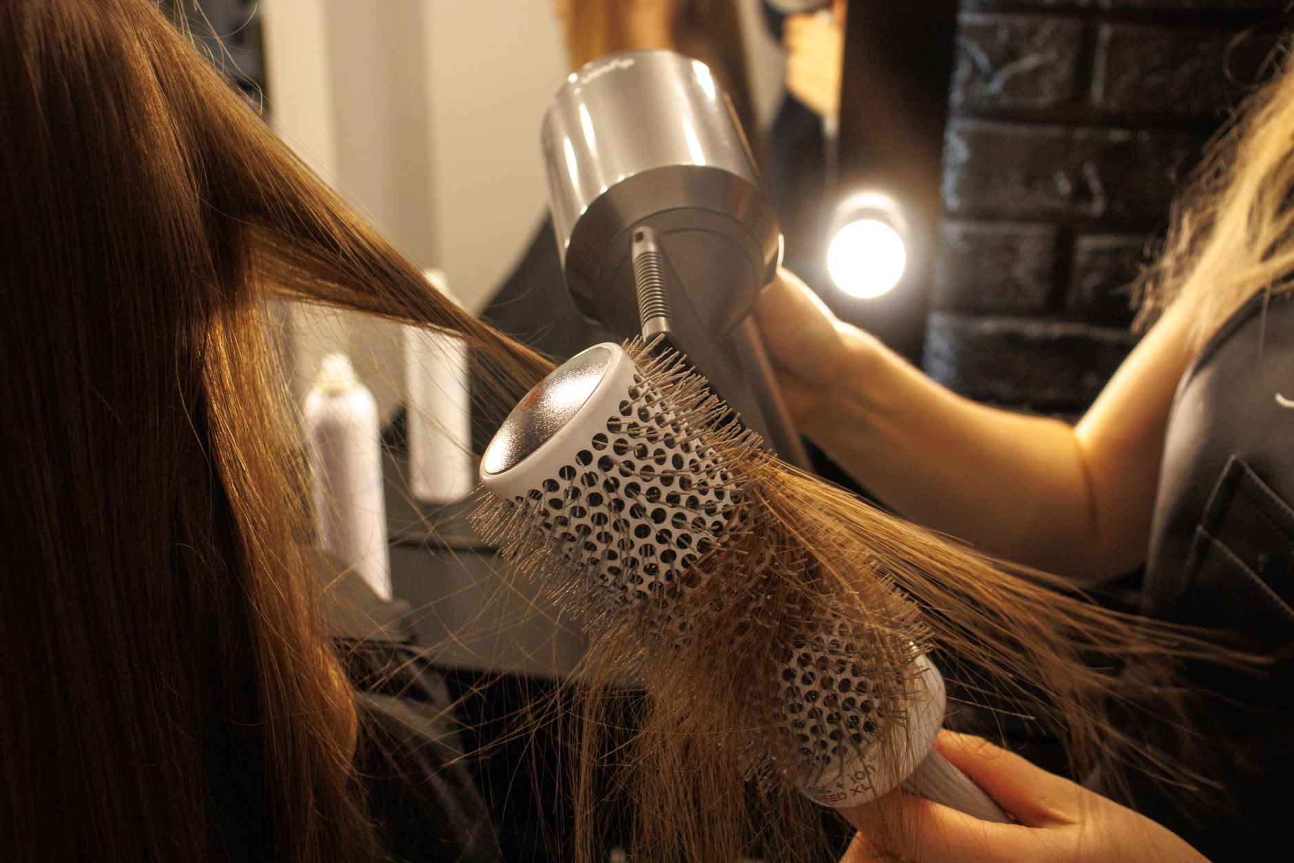 Finished textured bang style with light hold product applied to ends