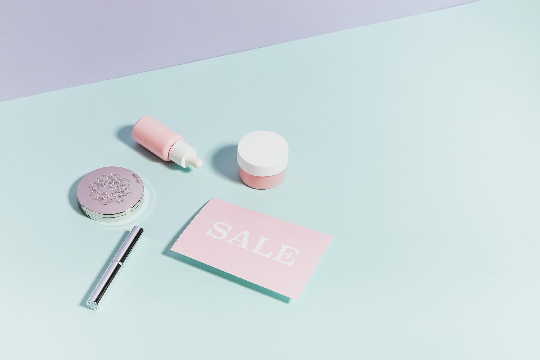 Assorted affordable cosmetics and lip tints arranged on a flat surface