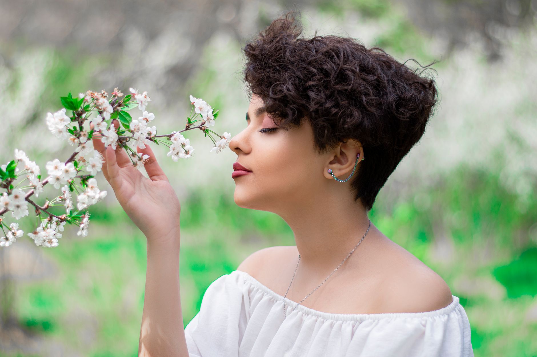 Woman with a clean, short pixie crop hairstyle