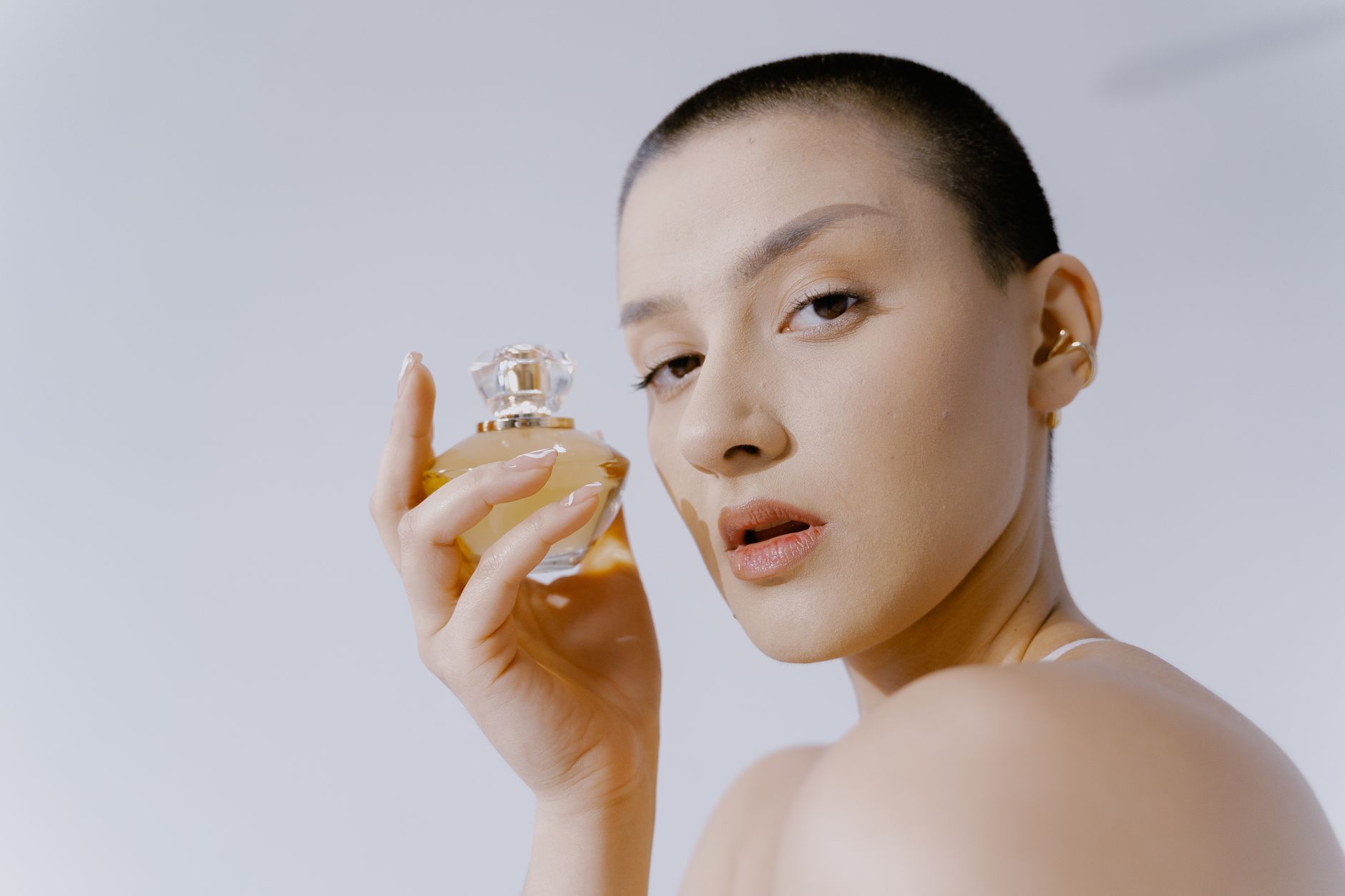 Perfume bottles and beauty products arranged on a vanity surface