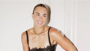Aryna Sabalenka Dresses Like She Plays: On Her Own Terms Woman wearing large statement jewelry and a confident off-duty outfit