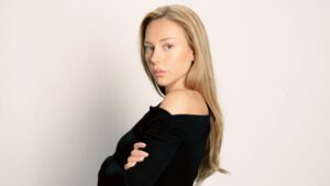 Ester Expósito Plays a Fighter On Screen. Off It, Young Spanish actress in natural lighting, minimal makeup, direct gaze at camera