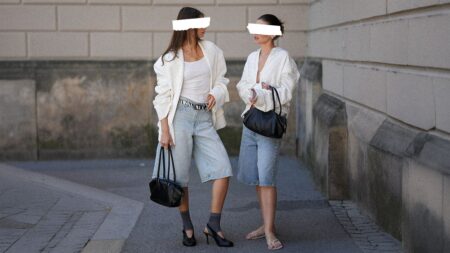 What to Do When Your Friend Notices You Copied Their Style Two women browsing clothing racks together in a boutique