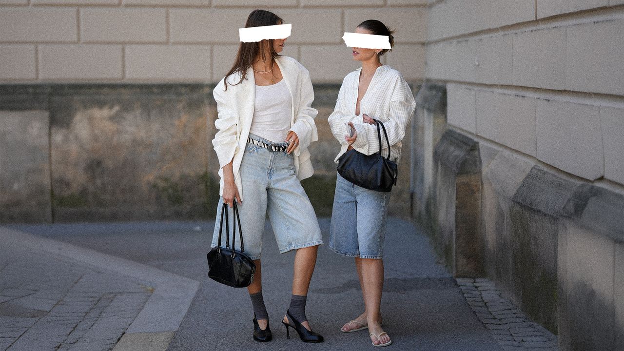 Two women browsing clothing racks together in a boutique