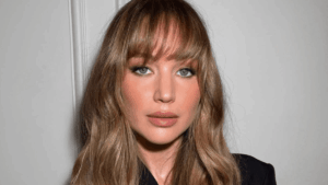 Jennifer Lawrence’s Butterfly Bangs: How to Get Chris Appleton’s Look Woman with soft butterfly bangs styled outward framing her face
