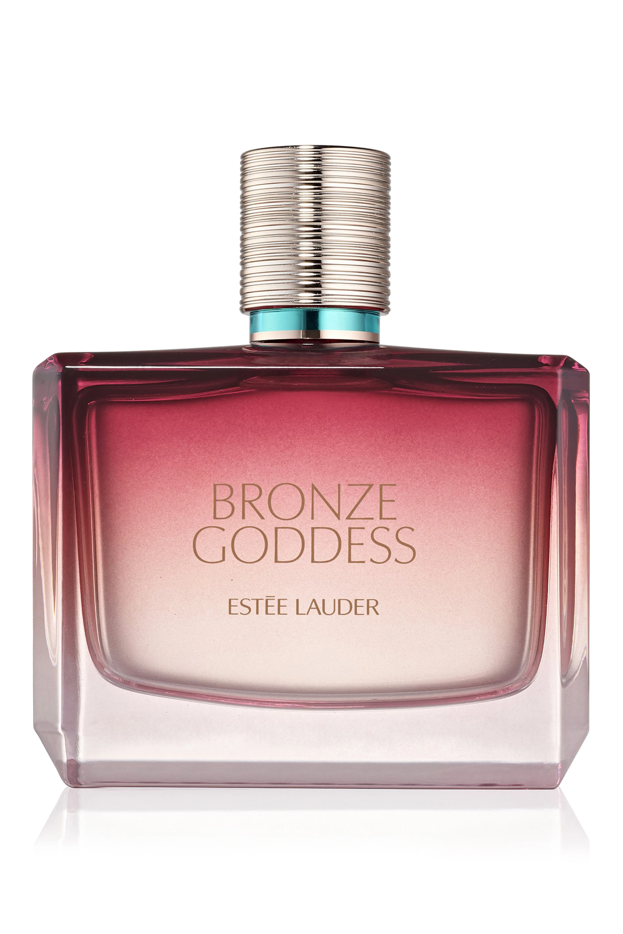 Close-up of a glass perfume bottle on a wooden surface with warm lighting