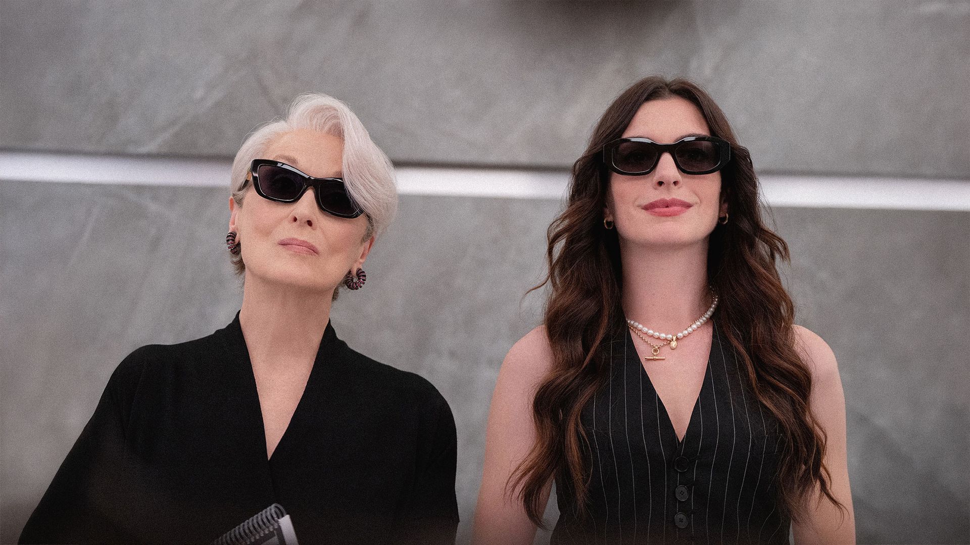 Colleagues in a workplace meeting with varied styles of professional dress